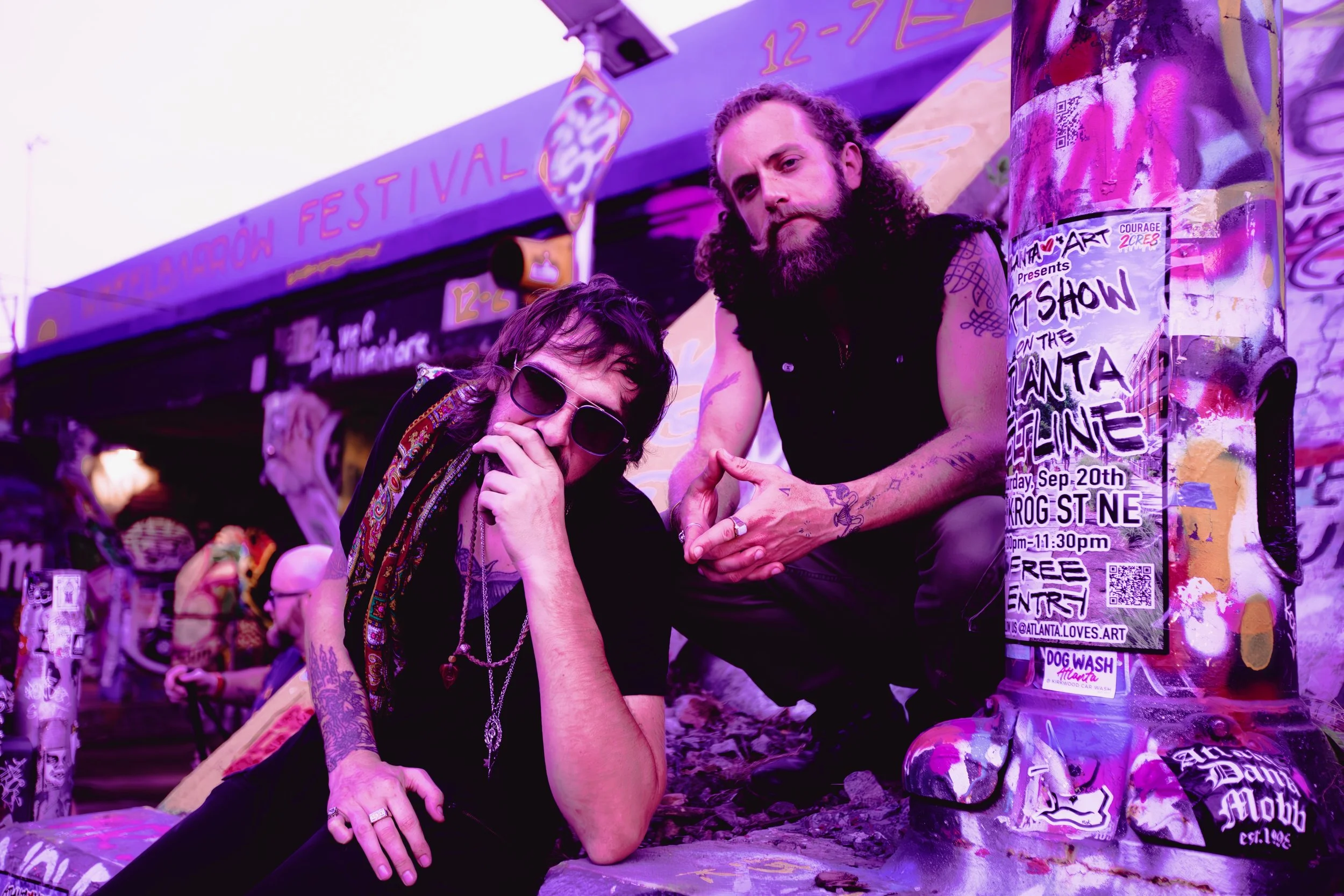 George Hamelin and Gustav Wilde posing in front of the infamous Krog Street Tunnel in Atlanta, Georgia.