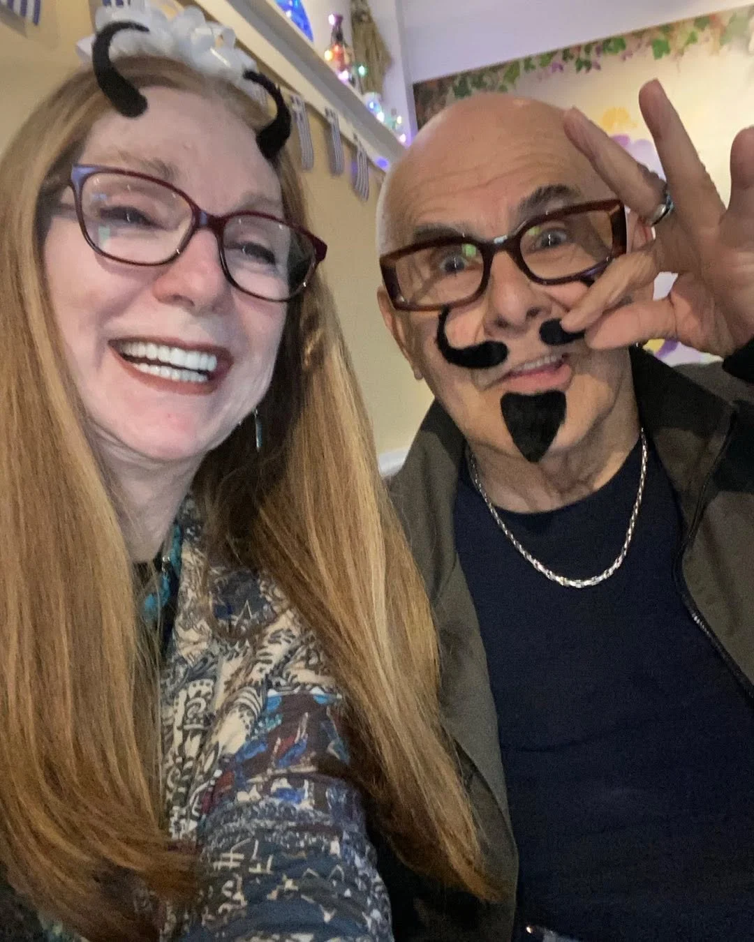 We celebrated a birthday of our dear friend, Penelope Mallos, and were given adhesive facial hair. Damon rocked the Salvador Dali look. While I used my mustache to become a little devil!