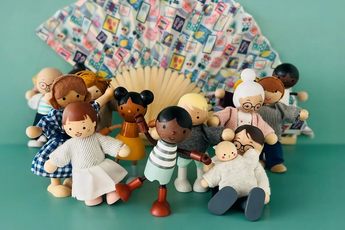 Wooden dolls celebrating Bubble & Speak’s 10th anniversary