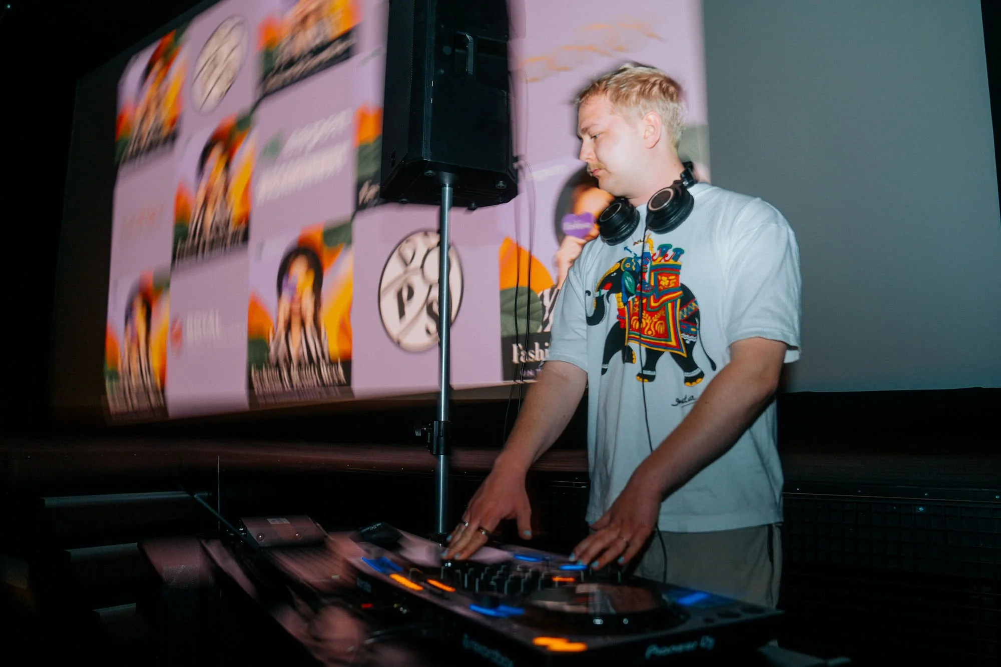 DJ playing at Wasarunway event wearing. awhite tshirt