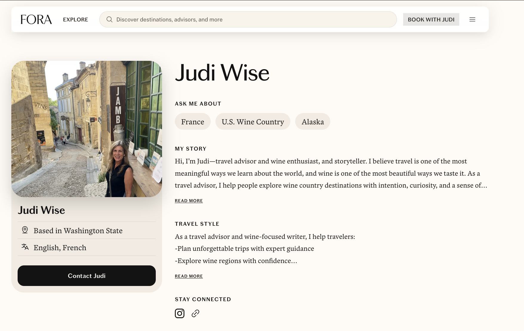 Profile page of Judi Wise on Fora website showing her photo, location in Washington State, language skills in English and French, and sections describing her story, travel style, and contact information.