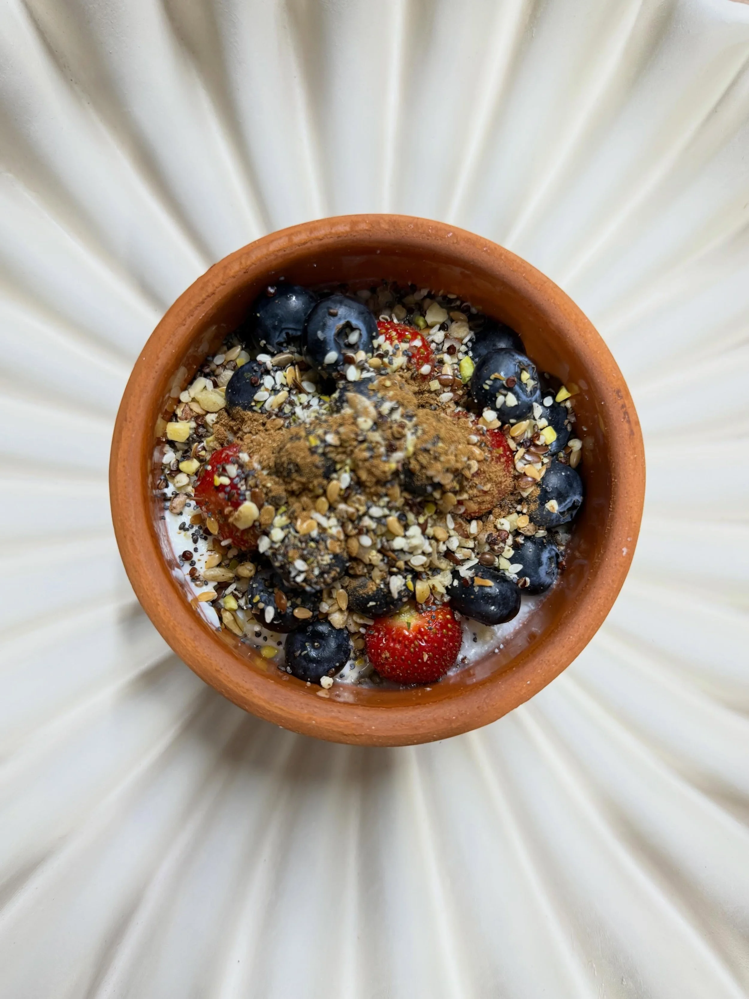 The most delicious sheep&rsquo;s yoghurt in a clay pot, filled with fruits from the garden, fibre boost &amp; hand blended sweet spice from @barneywylds 
What&rsquo;s not to love on this gorgeous Friday morning! Bon appetit! 

To taste this delicious