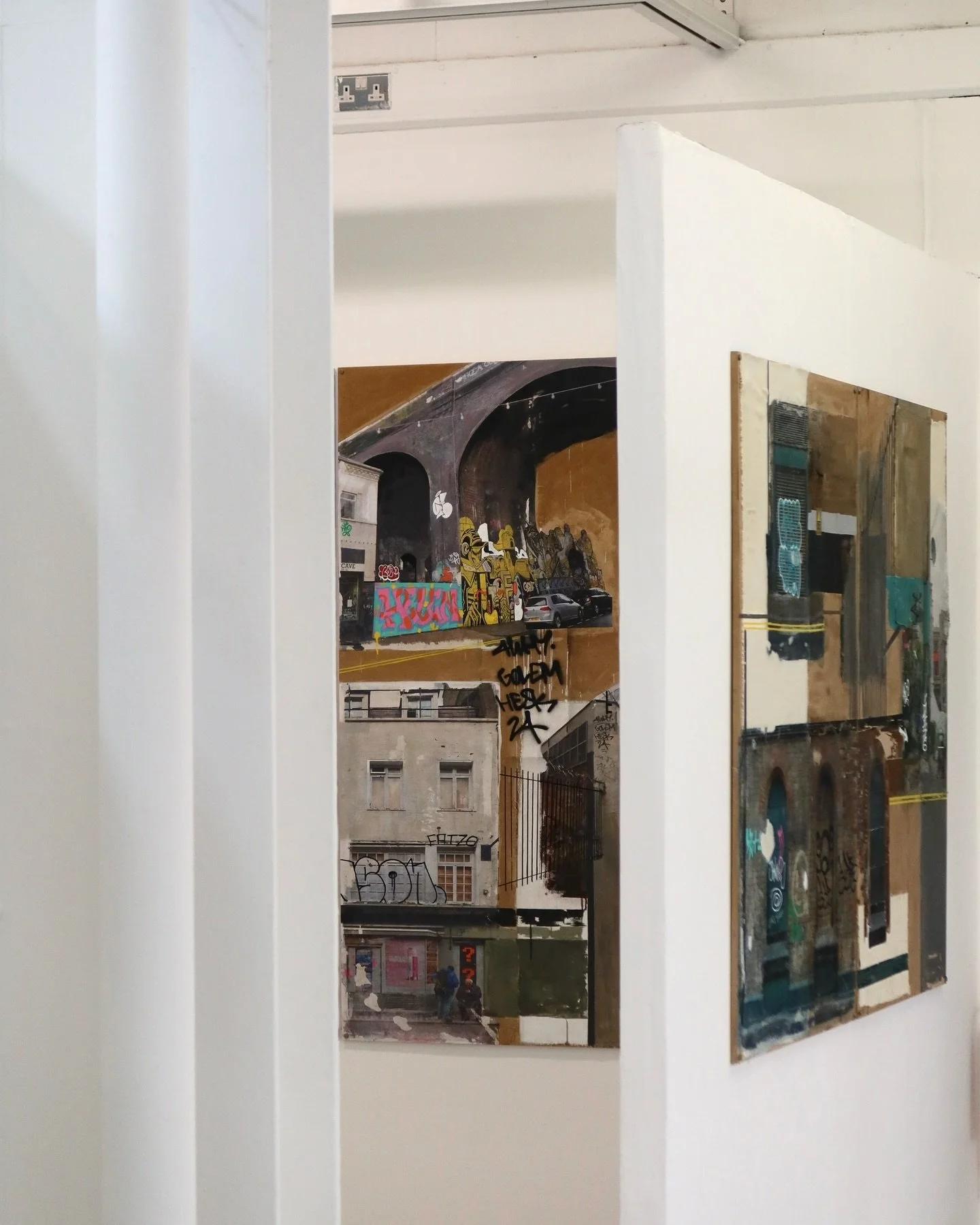 Curatorial choices included the use of yellow road marking to tie my exhibition space with the exploration of urban complexity and psychogeography, symbolising navigation and the intersections within city life. 
This approach highlights the layered n