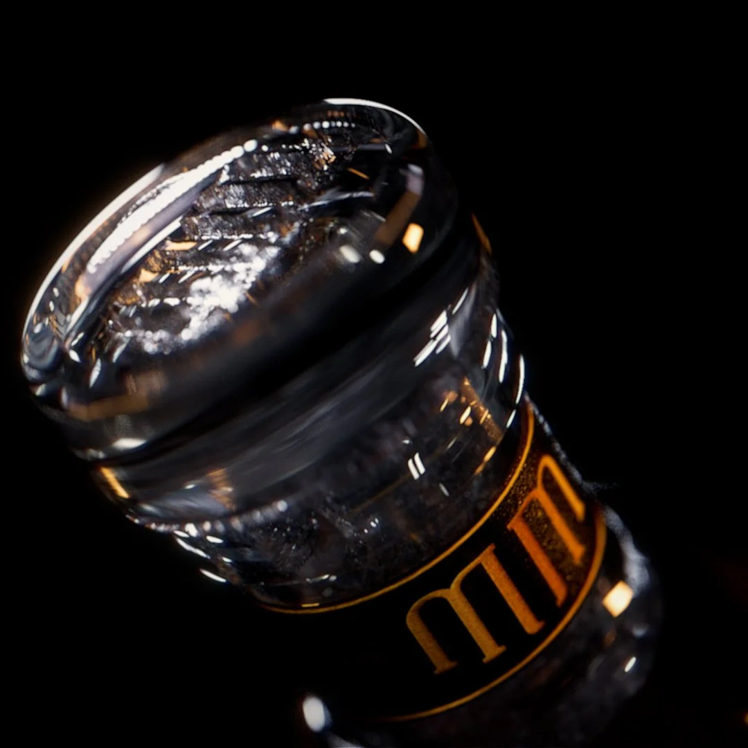 Close-up of a black and orange plastic bottle cap with a textured surface, set against a black background.