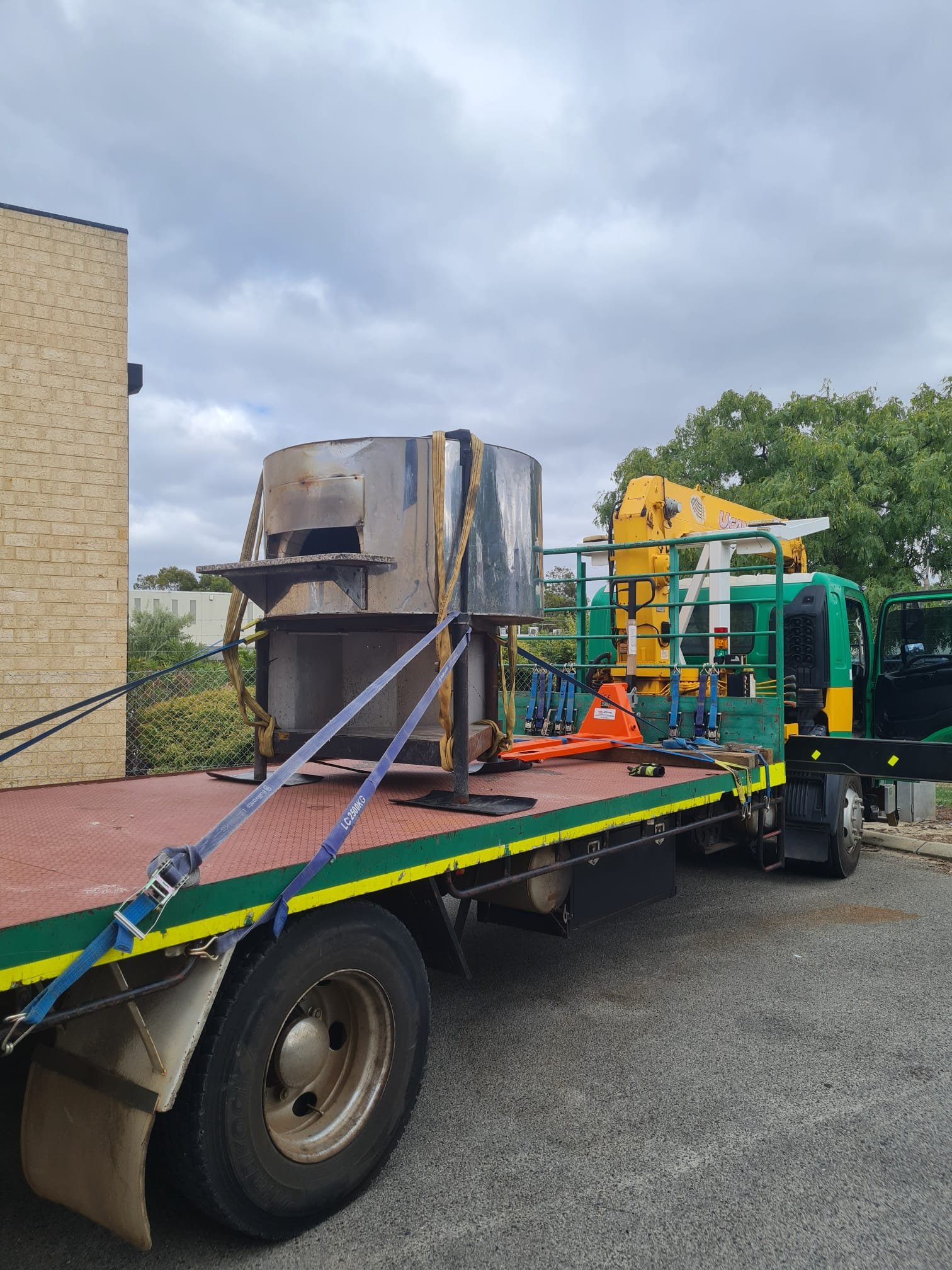 Professional transport and installation of commercial kitchen equipment in Perth including cool rooms, ovens, stainless benches and hospitality equipment using our Hiab crane truck.