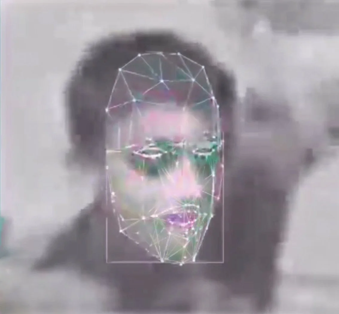 A person's face with a digital overlay of a wireframe skull in front of it. Digital Art. Generative Art. Face detection