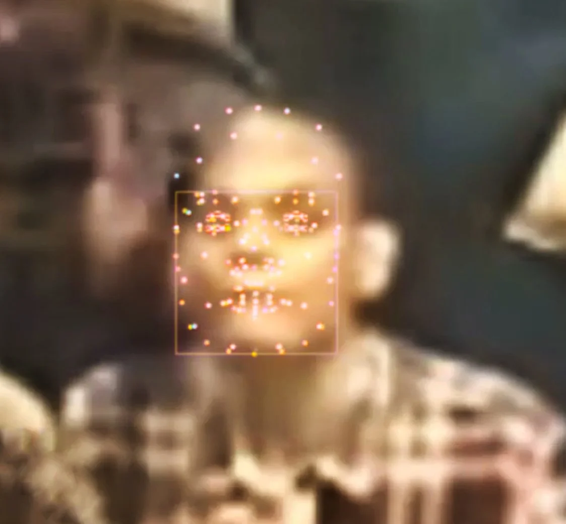 Close-up of a human face with digital facial recognition points and a glowing outline around the face. Digital Art. Generative Art. Face detection