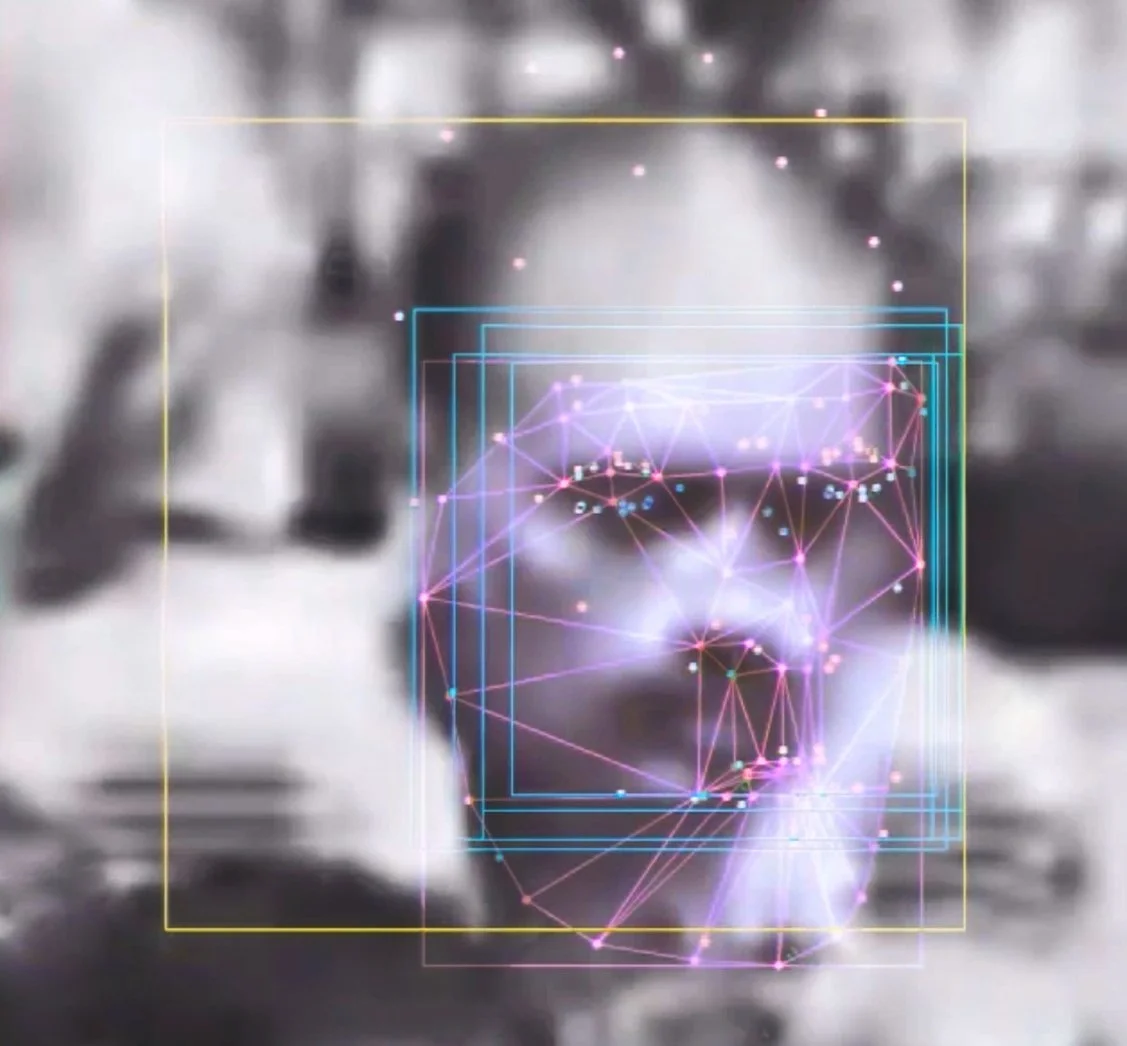 Close-up of a person's face with glasses, with digital lines, dots, and geometric shapes overlaid, creating a futuristic, holographic effect. Digital Art. Generative Art. Face detection