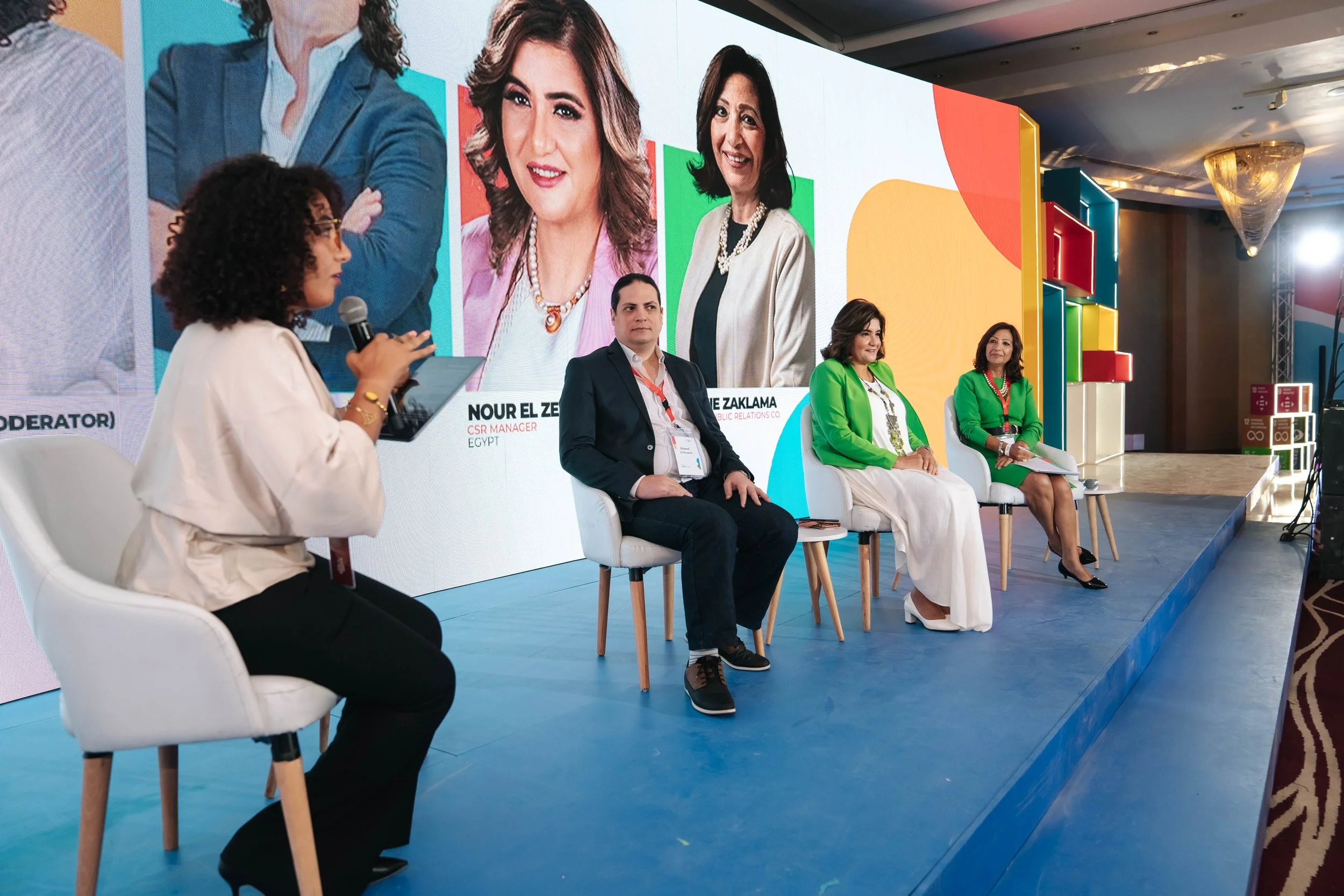 A panel discussion at the Regional Sustainable Development Forum, First Edition, with four participants sitting on stage in front of a large screen.