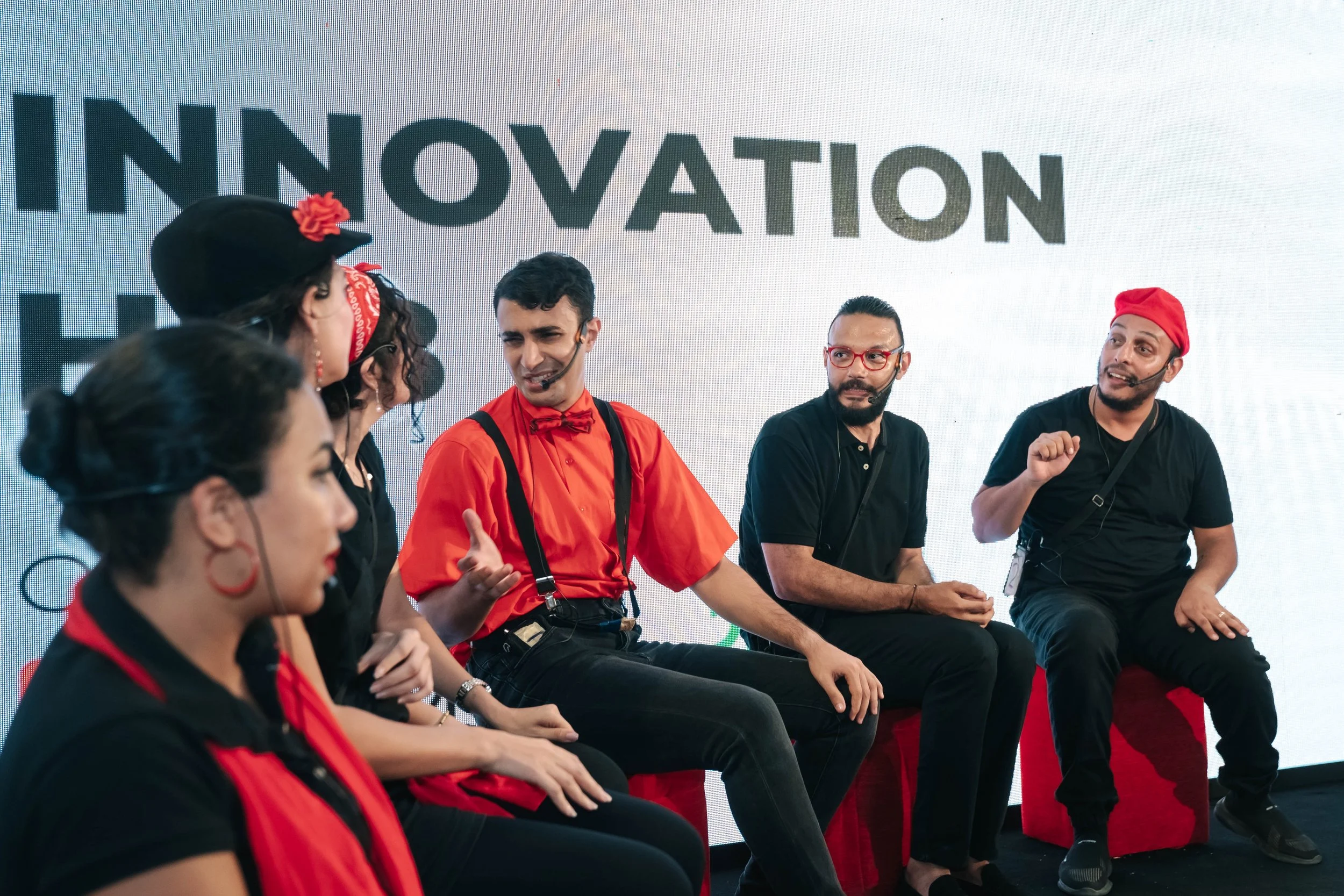 A group of six diverse people participating in a panel discussion at the Regional Sustainable Development Forum, First Edition, seated on stage in front of a large screen with the word 'INNOVATION' visible.