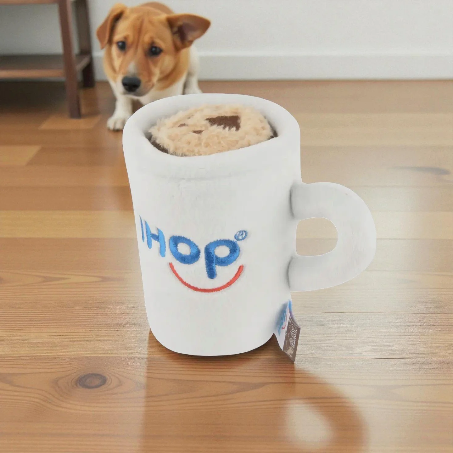 Close up of IHOP coffee mug dog toy showing iconic design and reinforced stitching