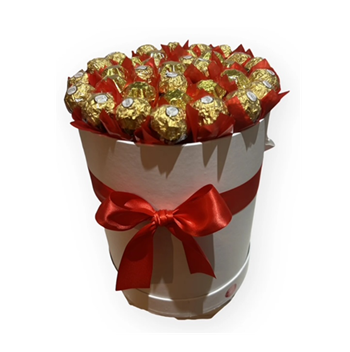 Ferrero rochers wrapped in red paper presented in a white hat box
