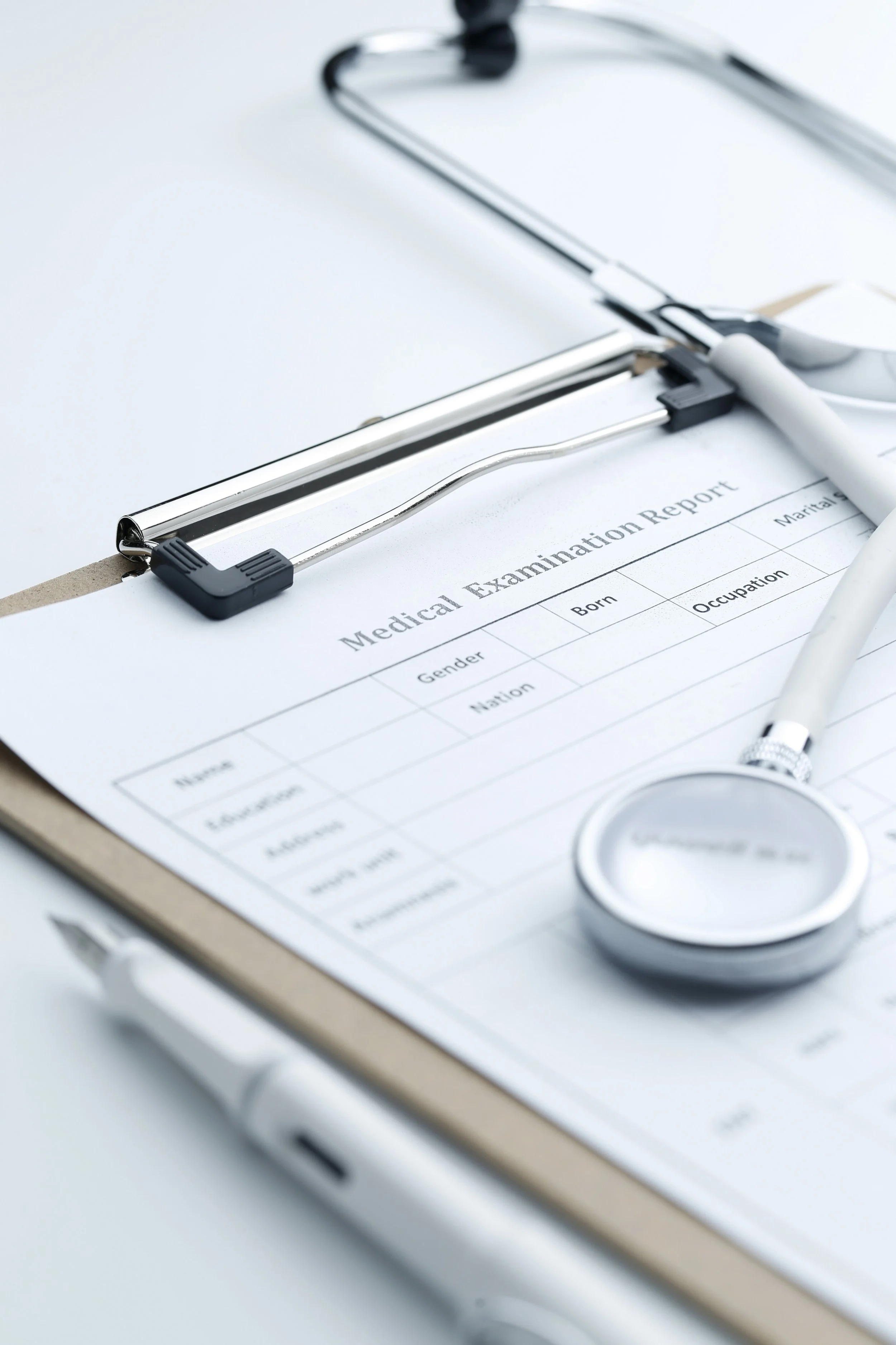 medical-examination-report-stethoscope-white-desktop.jpg