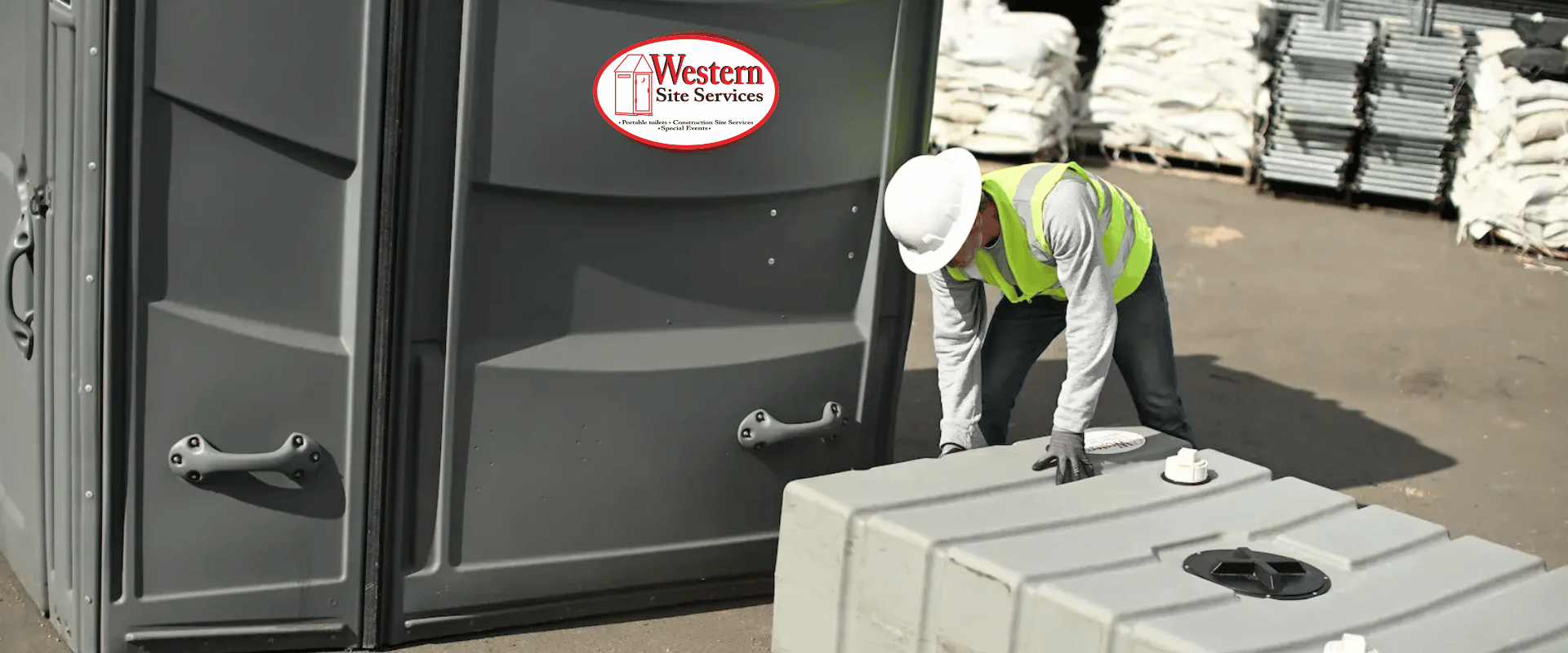 250 gallon holding tank set up under a restroom trailer at a job site