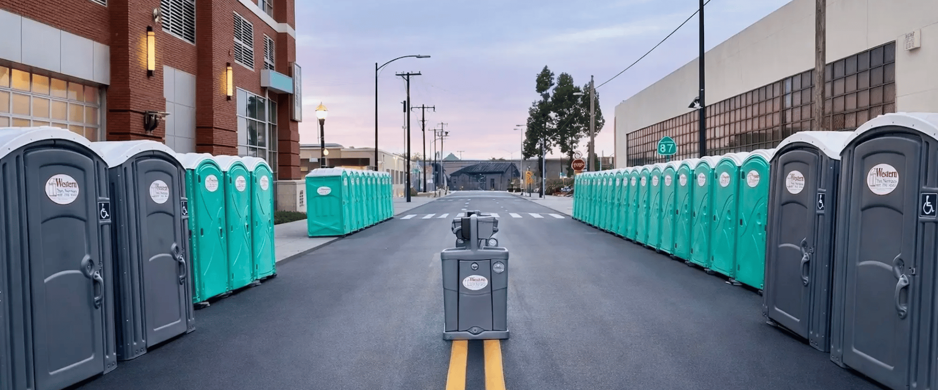 Line of standard portable toilets at a construction site