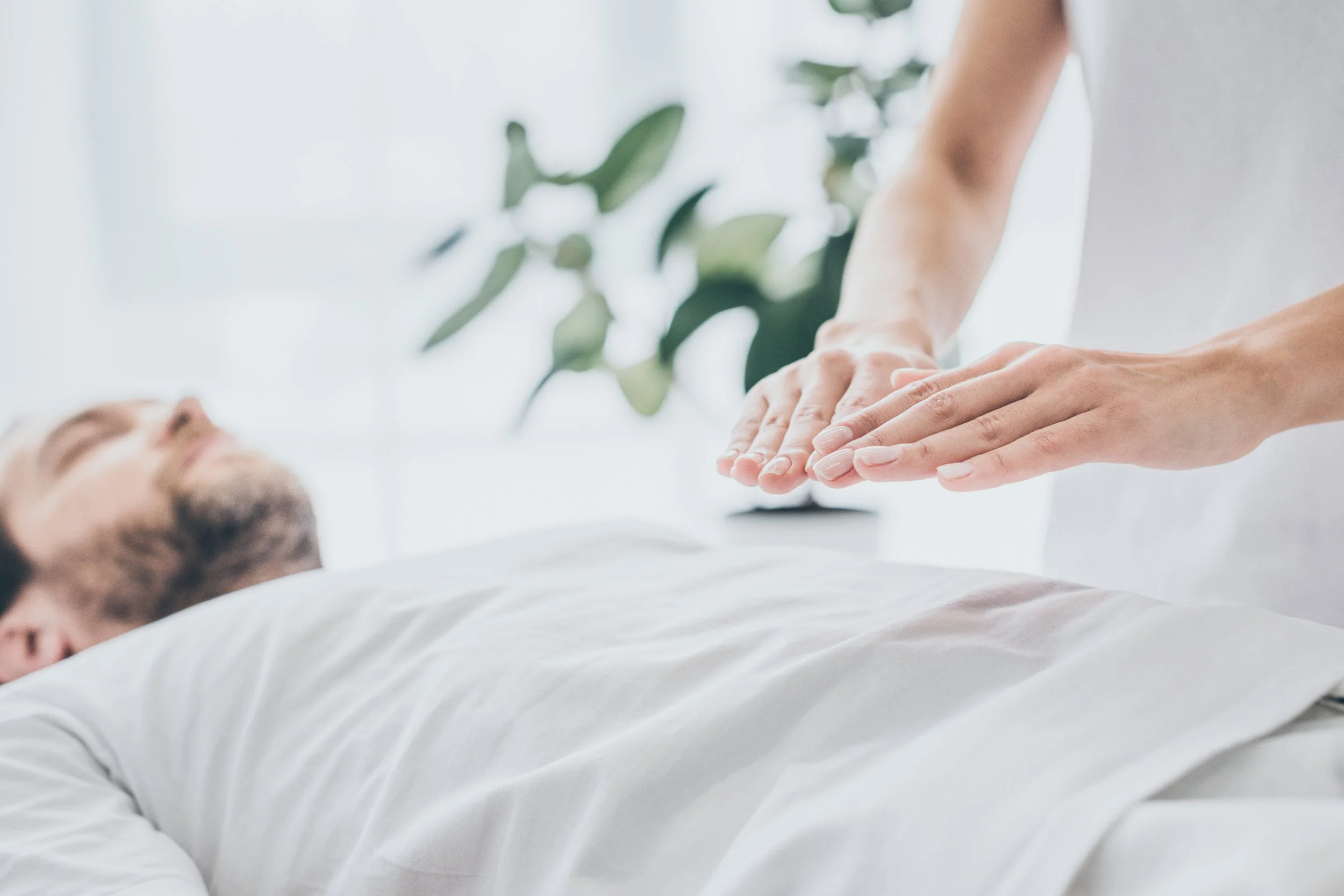 A person receiving CPR training from an instructor.