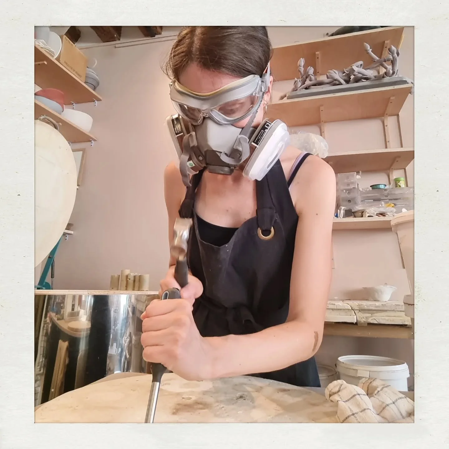Internship with @mad_morio Part II

Photo 1: Me scraping glaze off the kiln plates. In this case, two effect glazes have been applied too thickly and the excess has melted off the clay body onto a kiln shelf. This has happened to me too. But this pho