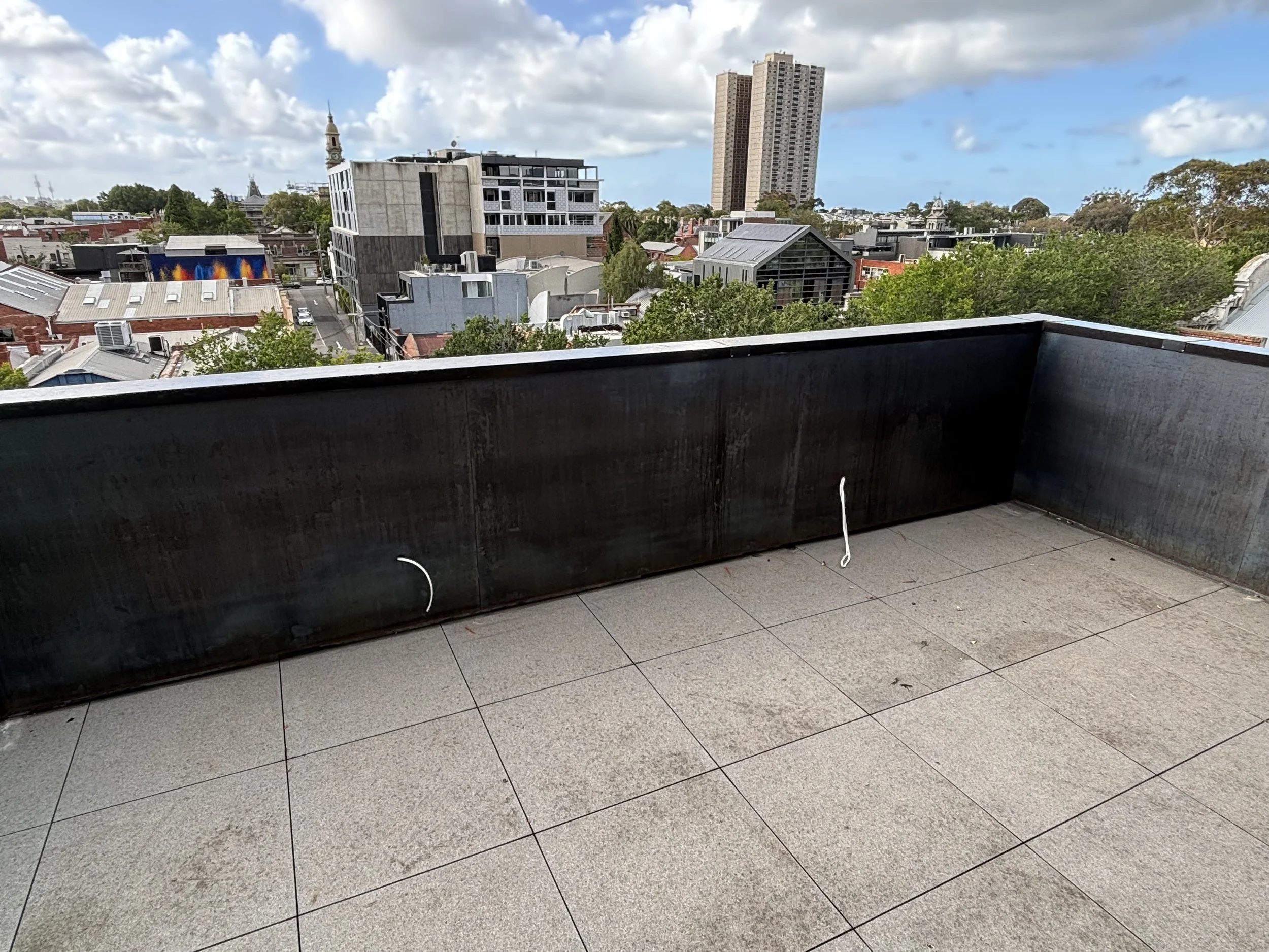 Steel and corten framing for rooftop balcony 