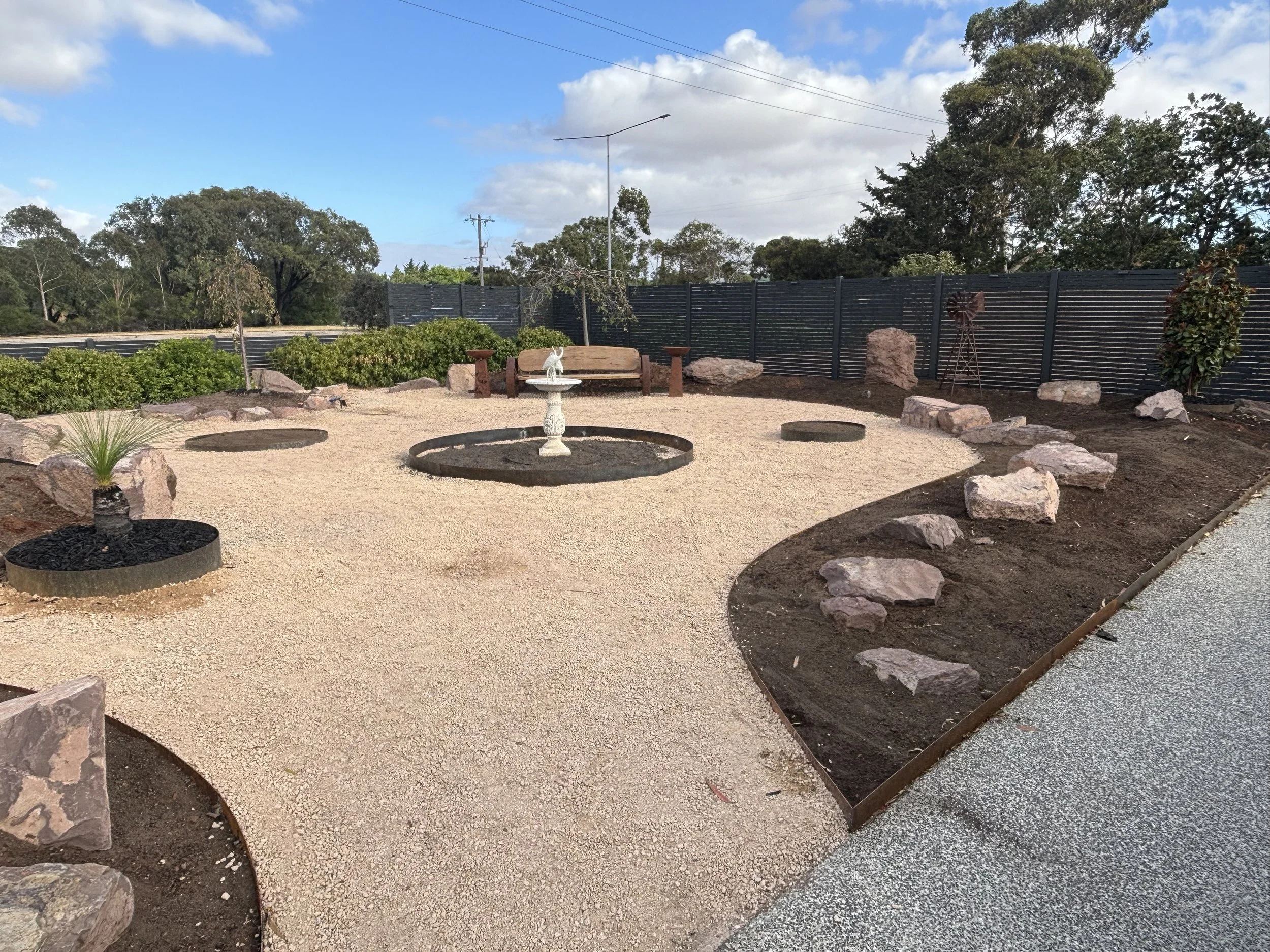 Steel and corten edging for landscaped backyard
