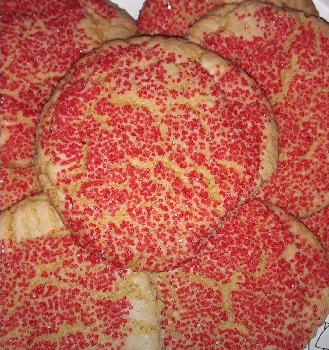 Close-up of cookies decorated with red sugar sprinkles.