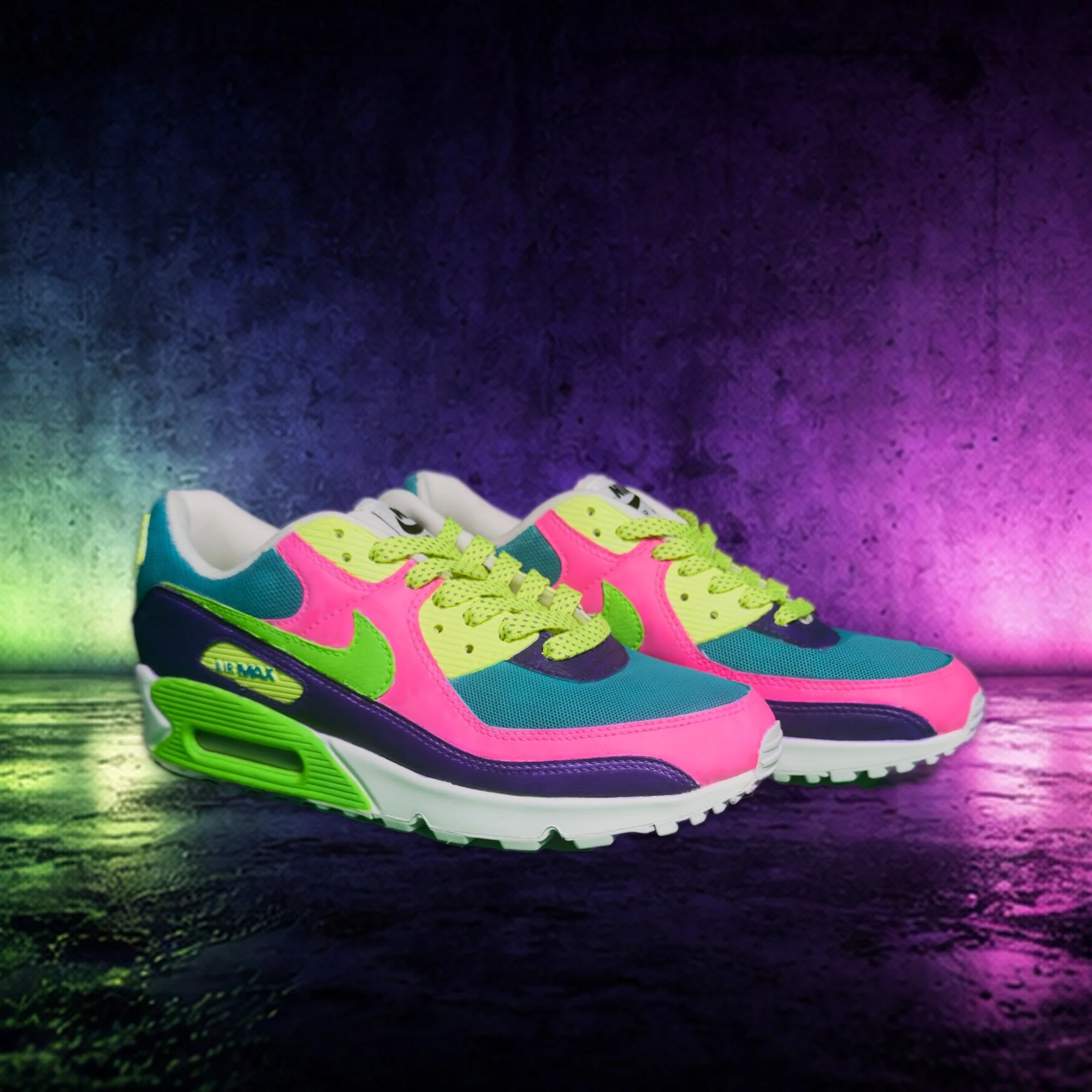 Pair of colorful Nike Air Max sneakers placed on a wet surface with a vibrant, multicolor background.
