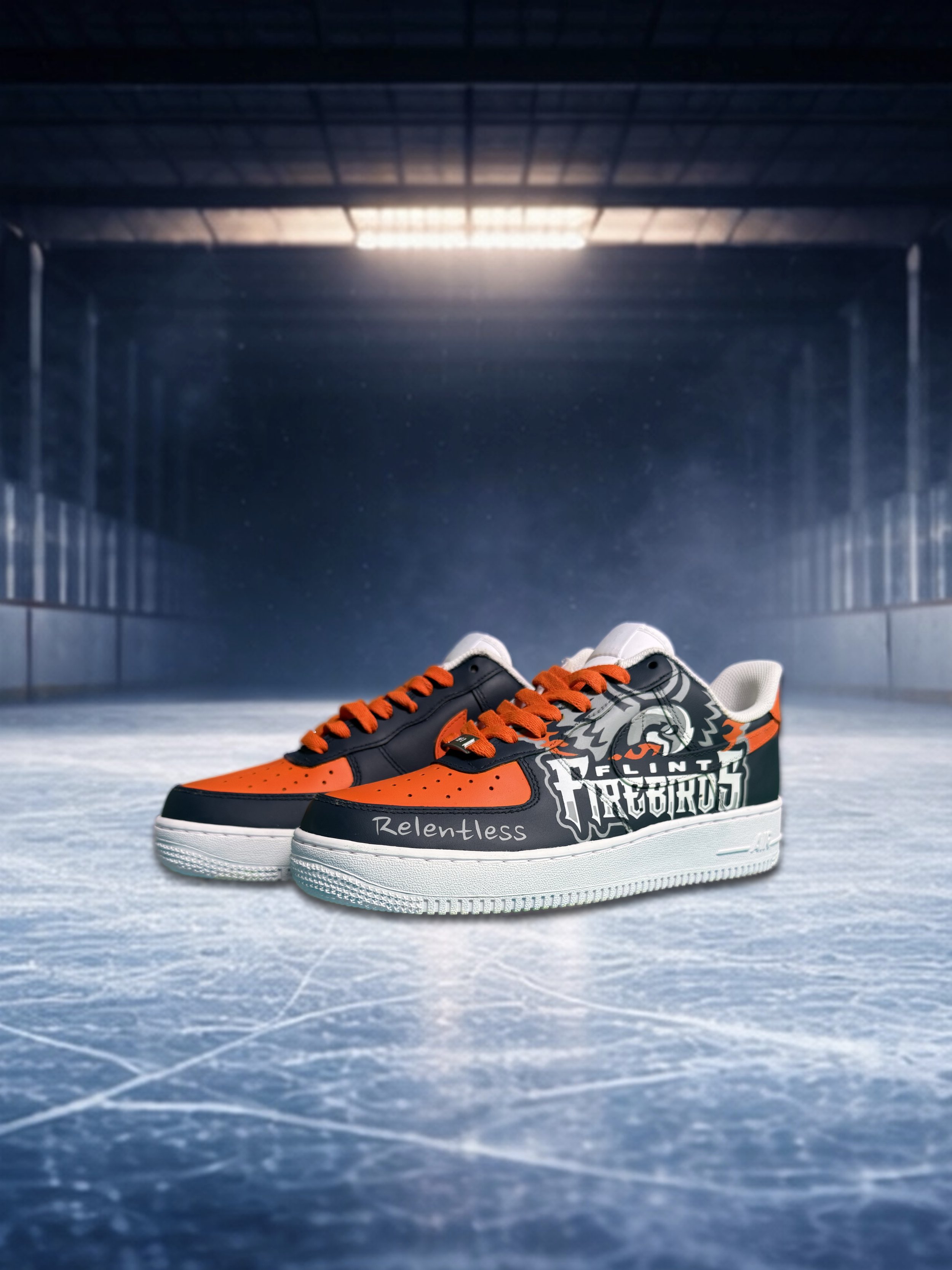 Pair of hockey sneakers with flame and text design on ice rink