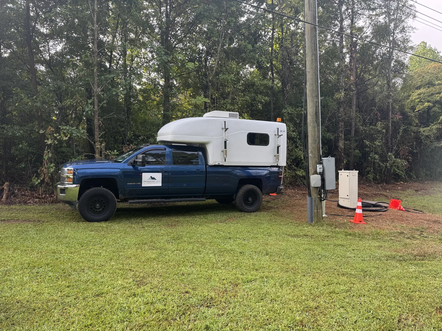 Golden Corner Communications splicing truck set up at a utility pole