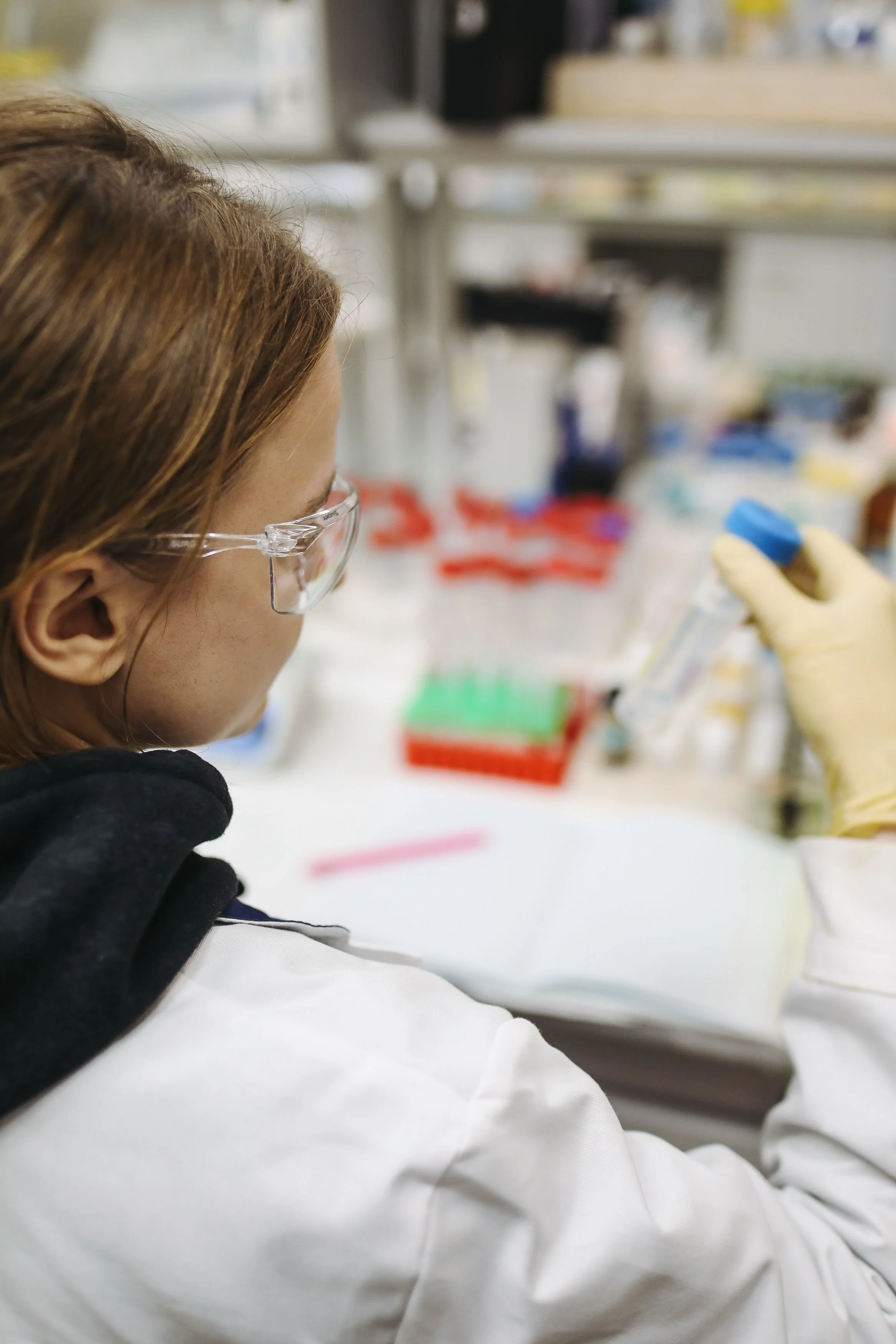 Scientist looking at a test tube