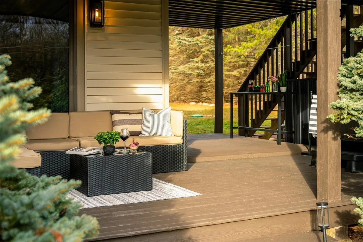 Lower deck at the lodge with shaded seating and outdoor gathering space