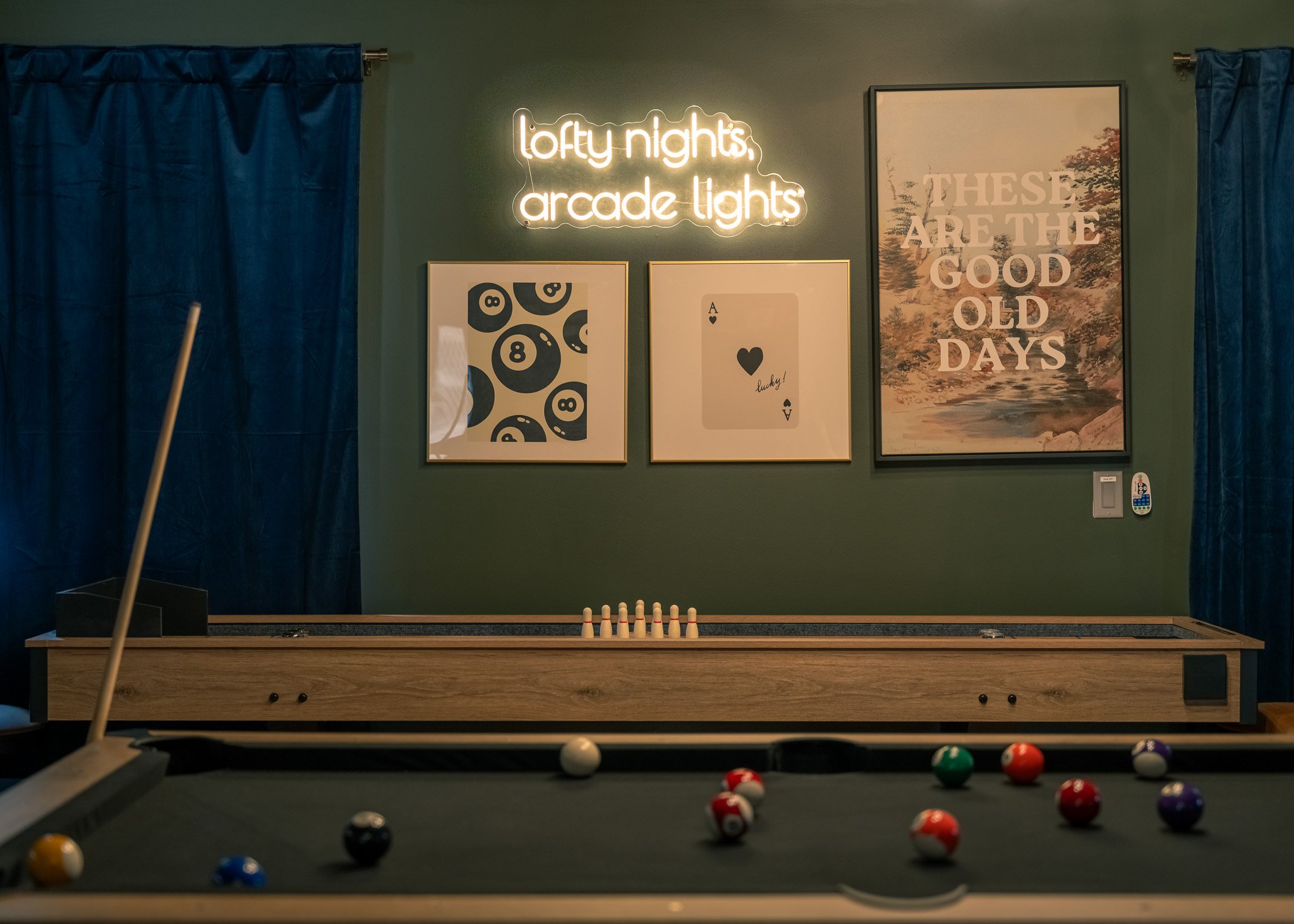 Lodge game room with pool table arcade machines and entertainment space