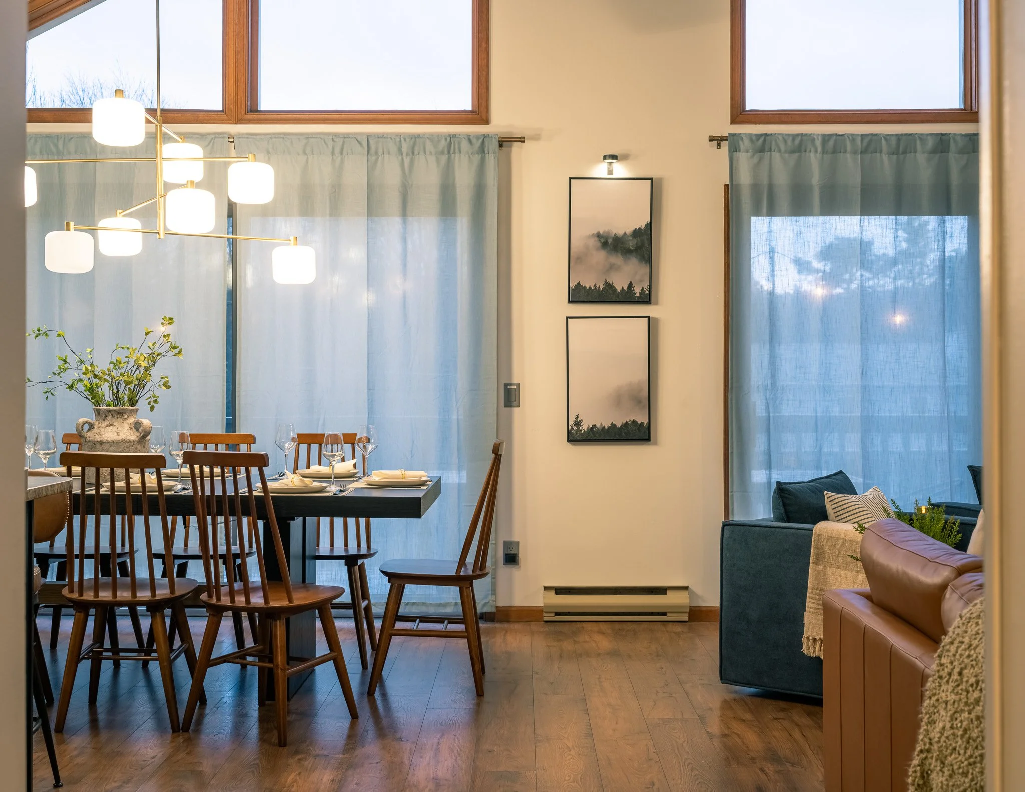Open dining and kitchen area at the lodge with modern design and large table