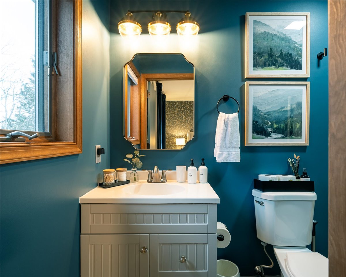 Clean modern bathroom at the lodge with bright lighting and elegant design