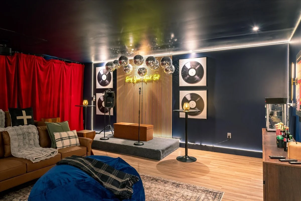 Karaoke stage at the lodge with microphones and colorful lighting setup