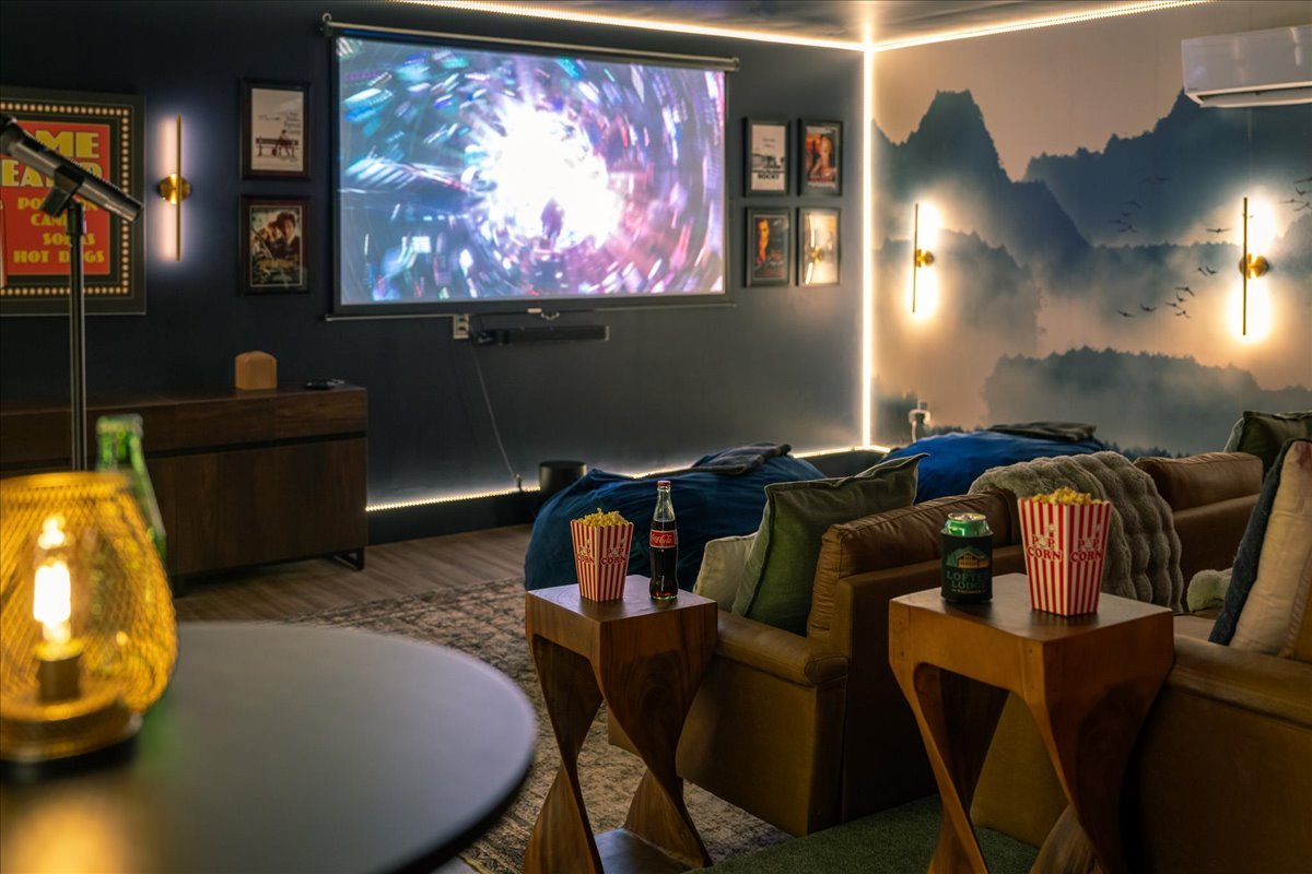 Private theater room at the lodge with large screen and comfortable seating