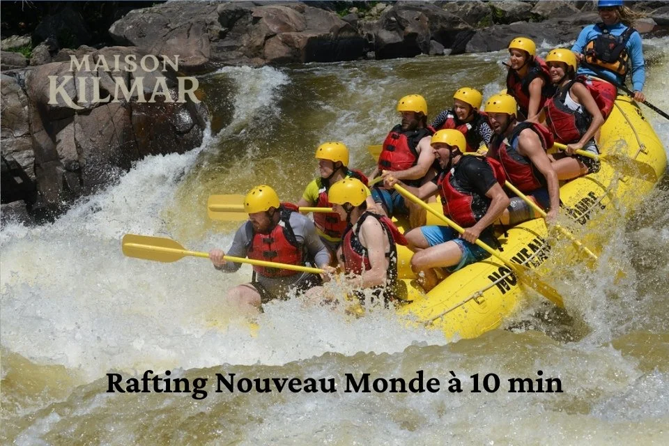 Group of people white-water rafting in a rapid river, wearing life jackets and helmets.