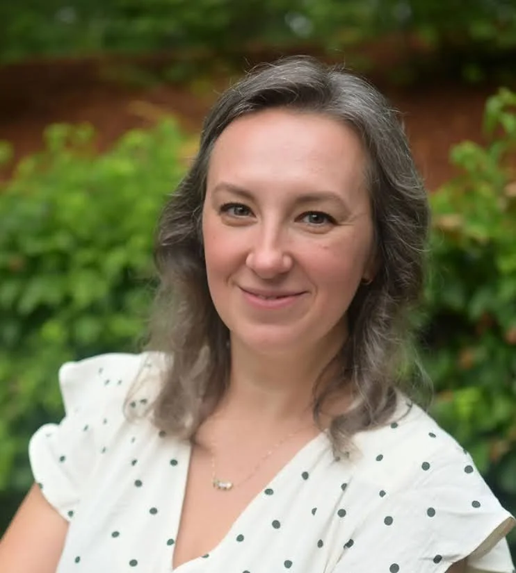 Yelena Barbosa, co-founder of Balterra, smiling outdoors.