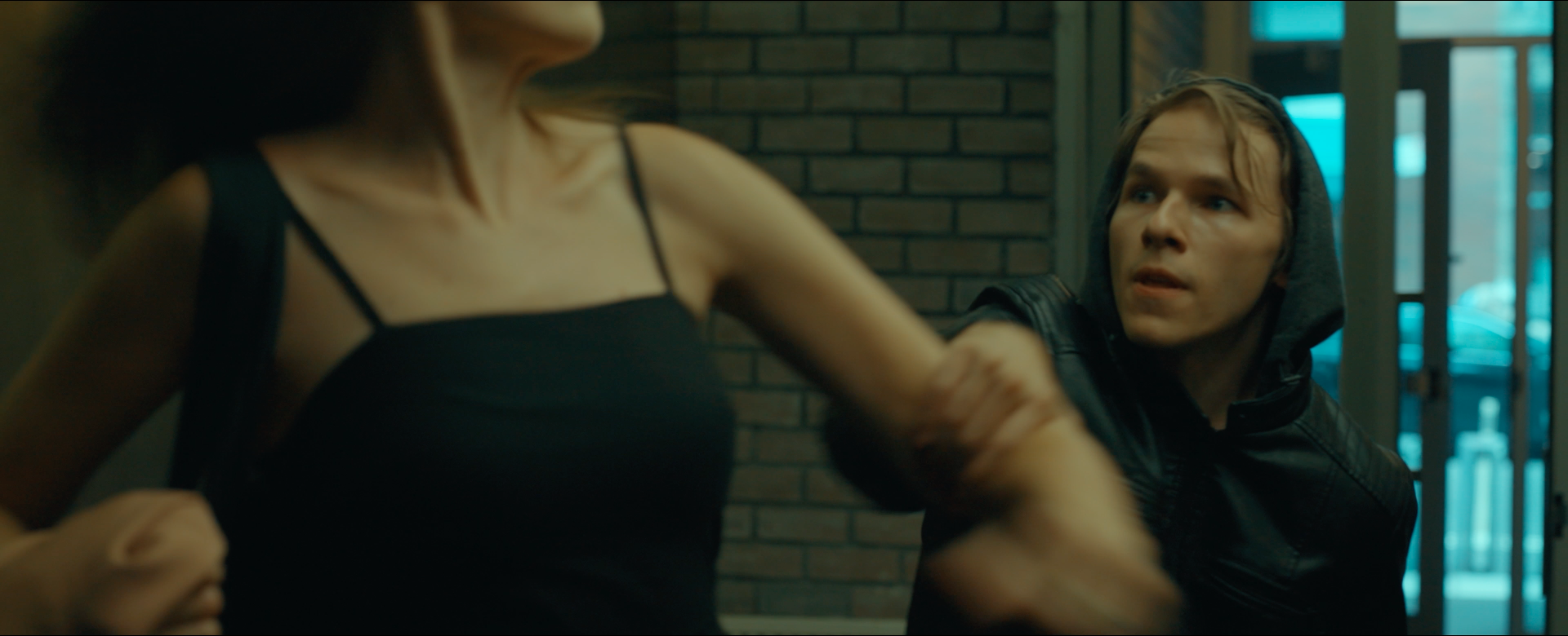 The Stalker, John, grabs Carol's arm 