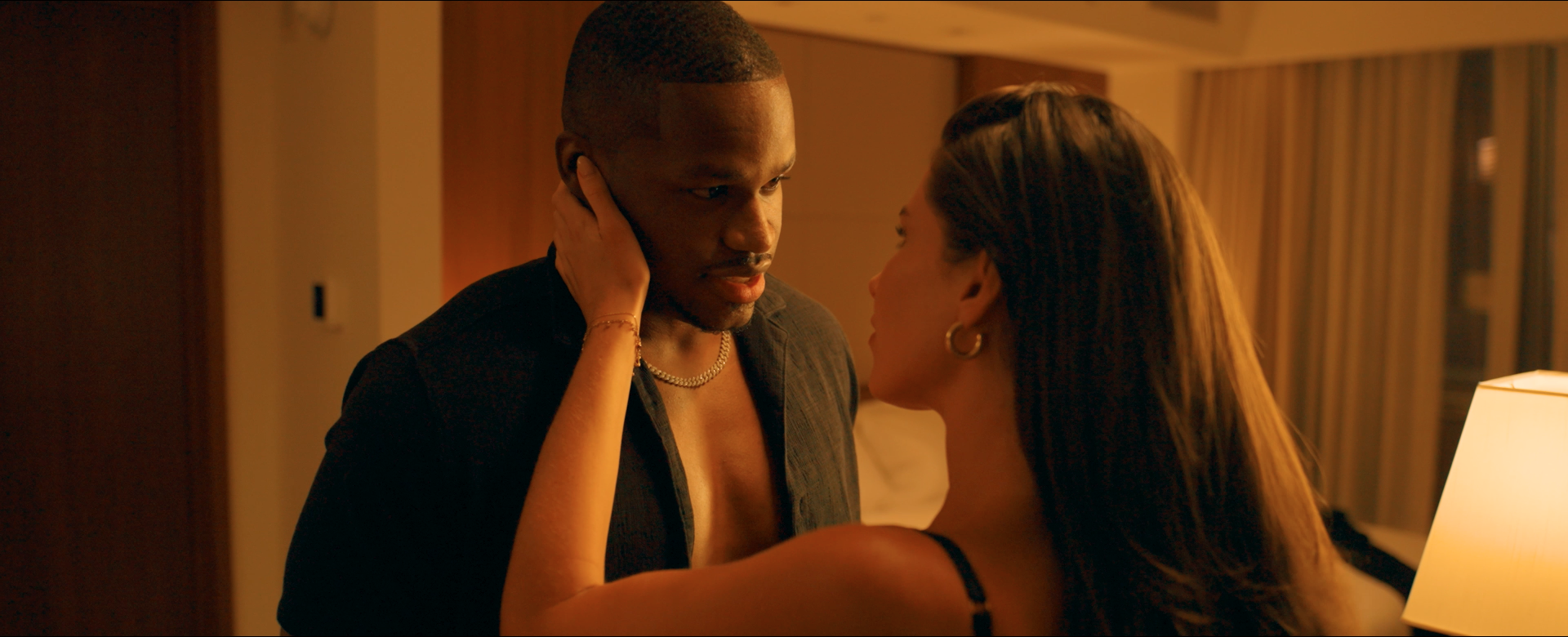Joe and Renee glance at each other in the Langham Hotel in New York City