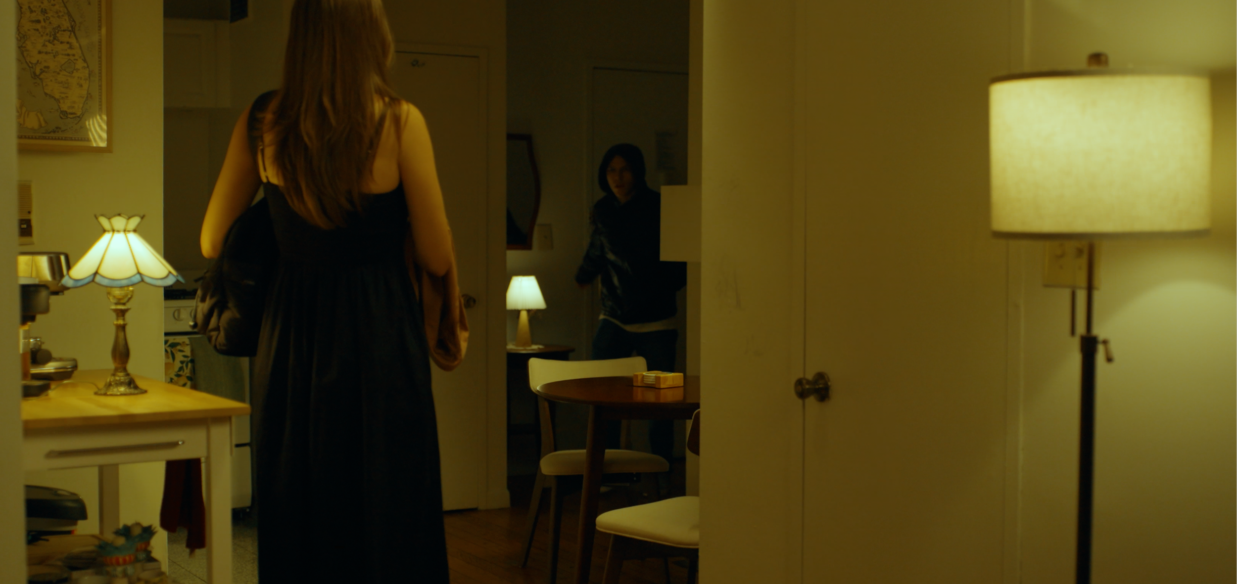 Carol and John enter Carol's apartment in the East Village in New York City