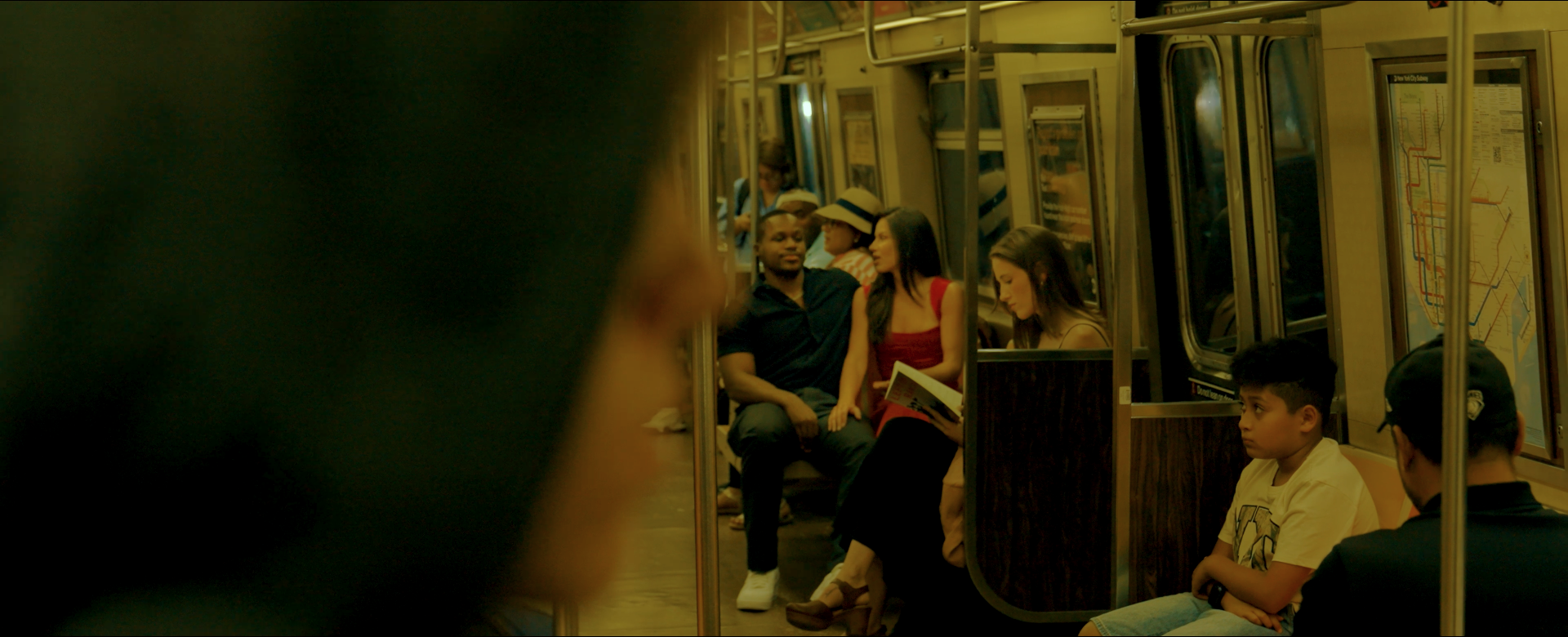 John, Renee, Joe, and Carol on the subway in Another Day in New York