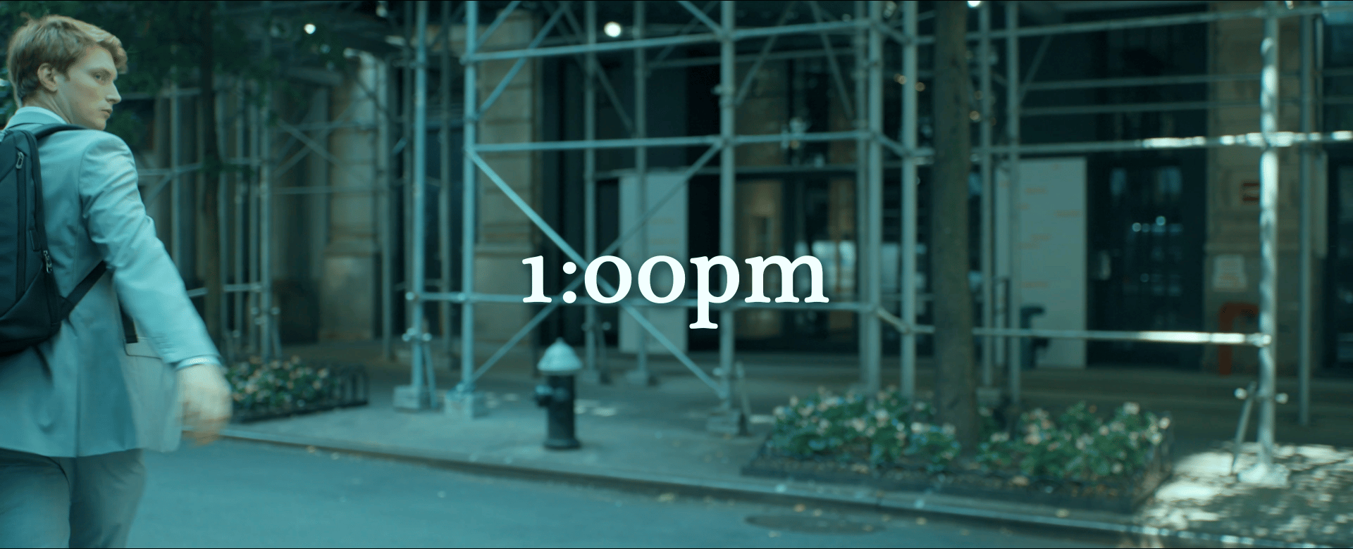 Cooper crosses 29th Street in New York City on his way to the Interview