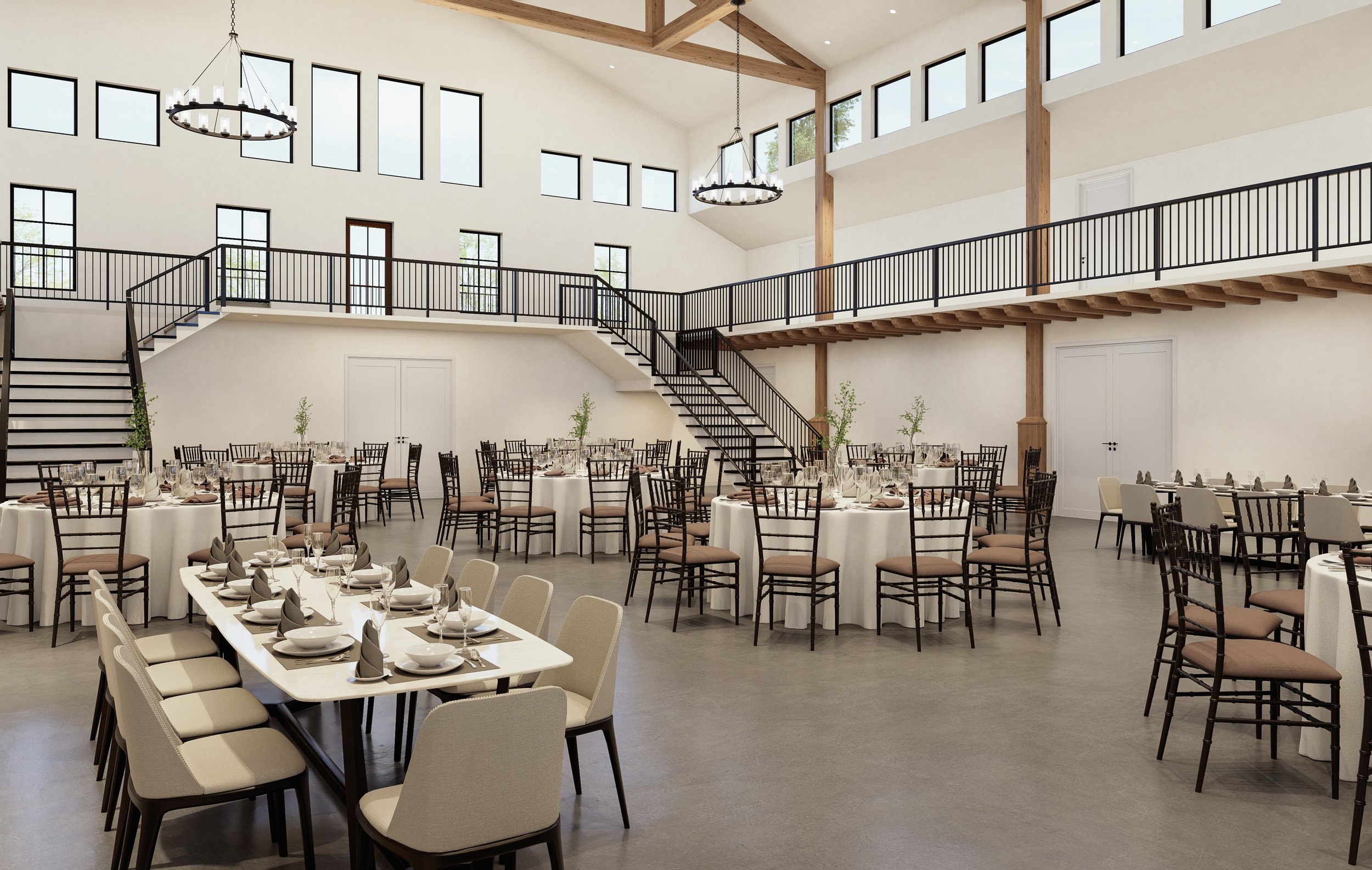 Elegant event hall with high ceilings, large windows, and wooden beams, decorated with round and rectangular tables set with white tablecloths, glassware, and napkins, surrounded by black and beige chairs, featuring a mezzanine with black railings and hanging chandeliers.