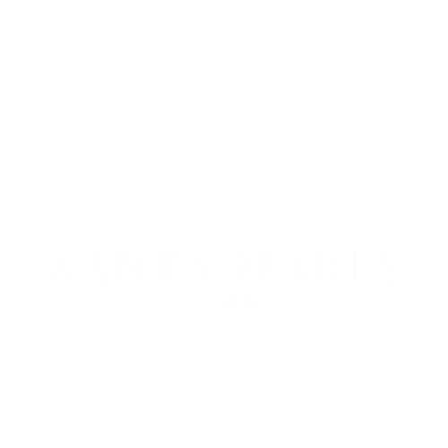 Silhouette of a barn and a windmill against a black background.