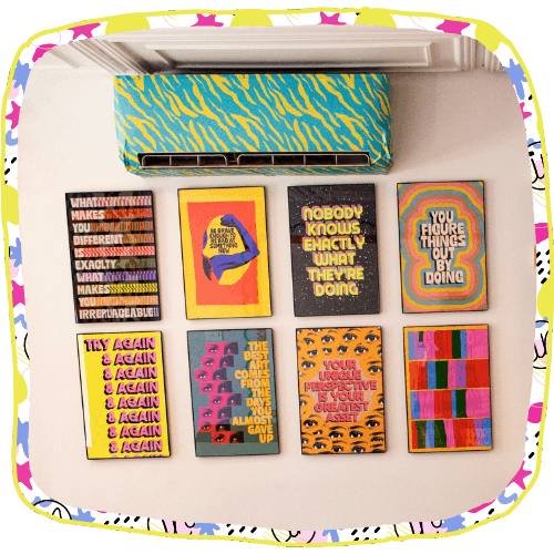 wall of cool posters at Artside In, art studio in Oceanside, NY