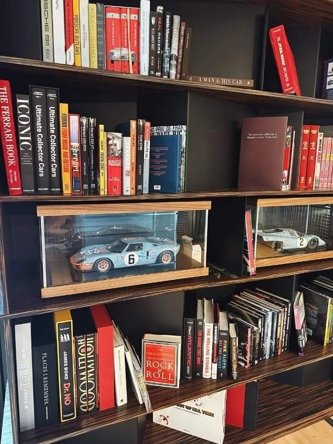 Bent steel library shelving with Macassar ebony veneer