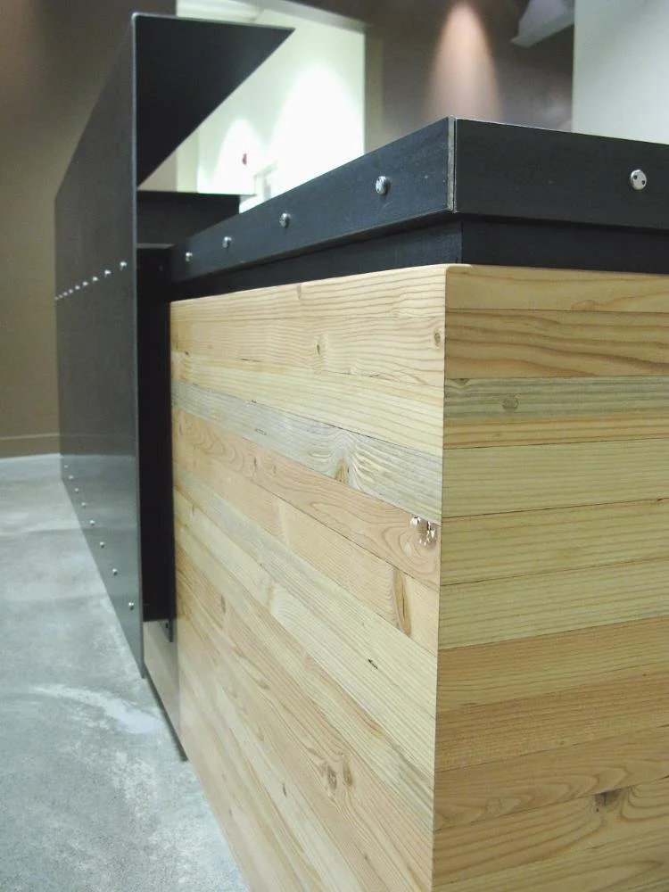 Reception desk in riveted blackened steel and vertical-grain fir