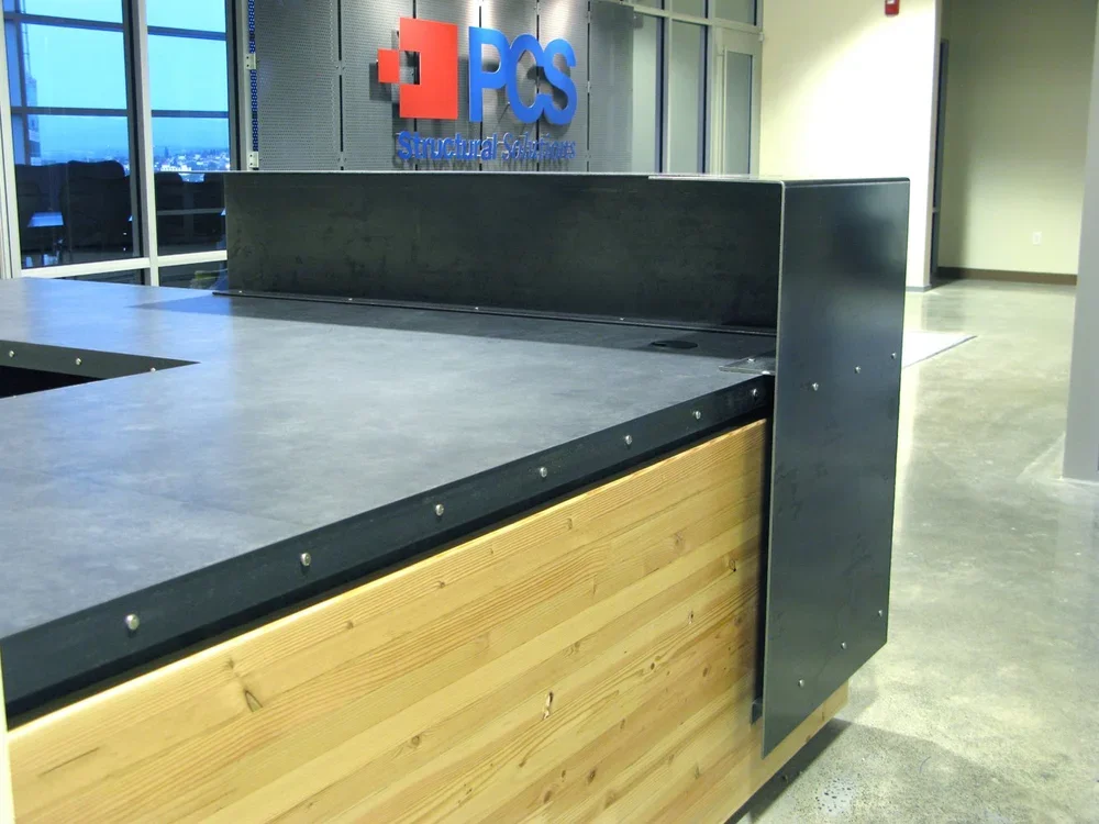 Reception desk in riveted blackened steel and vertical-grain fir