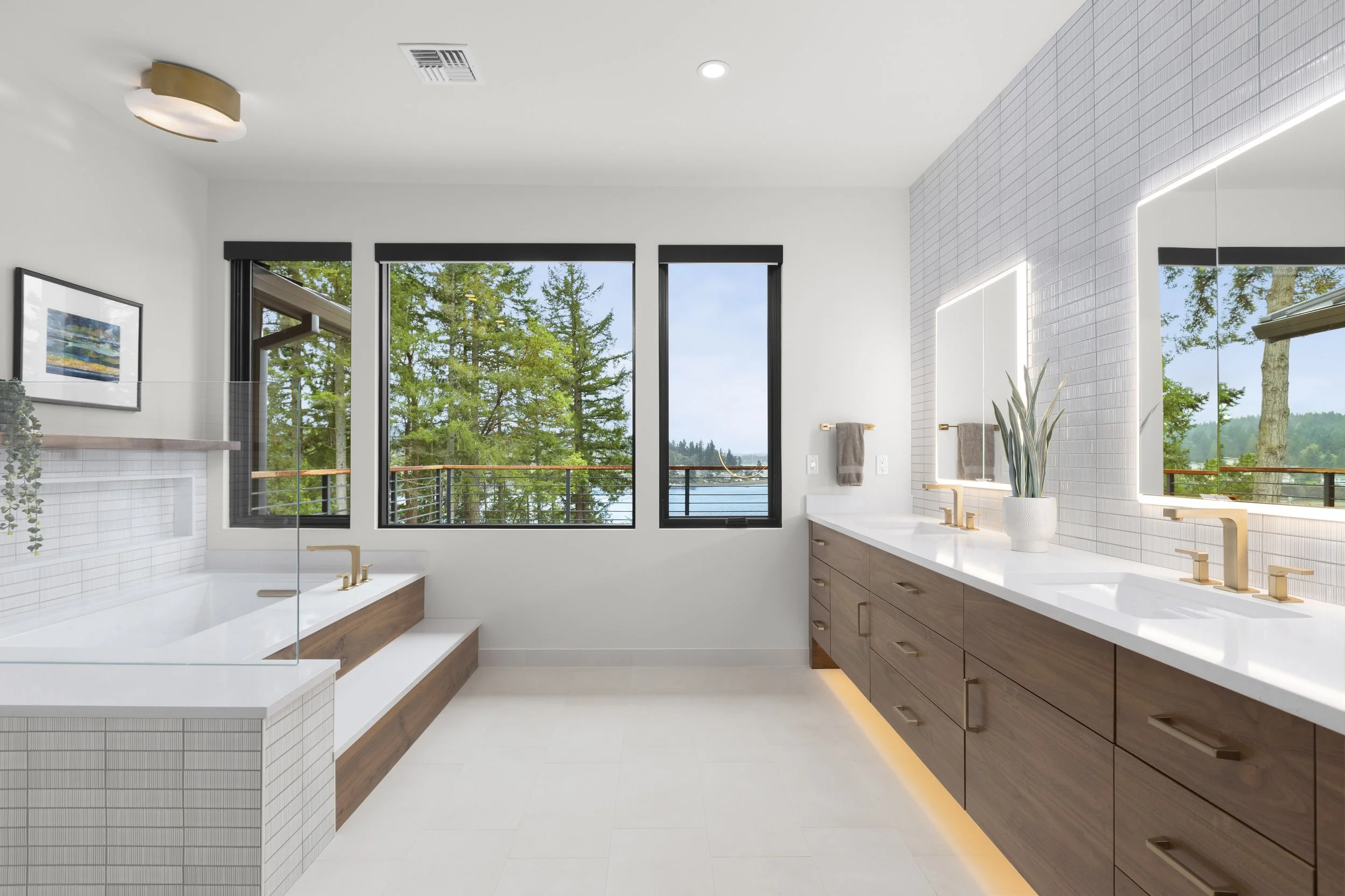 Secondary bathroom with custom walnut double vanity and tub