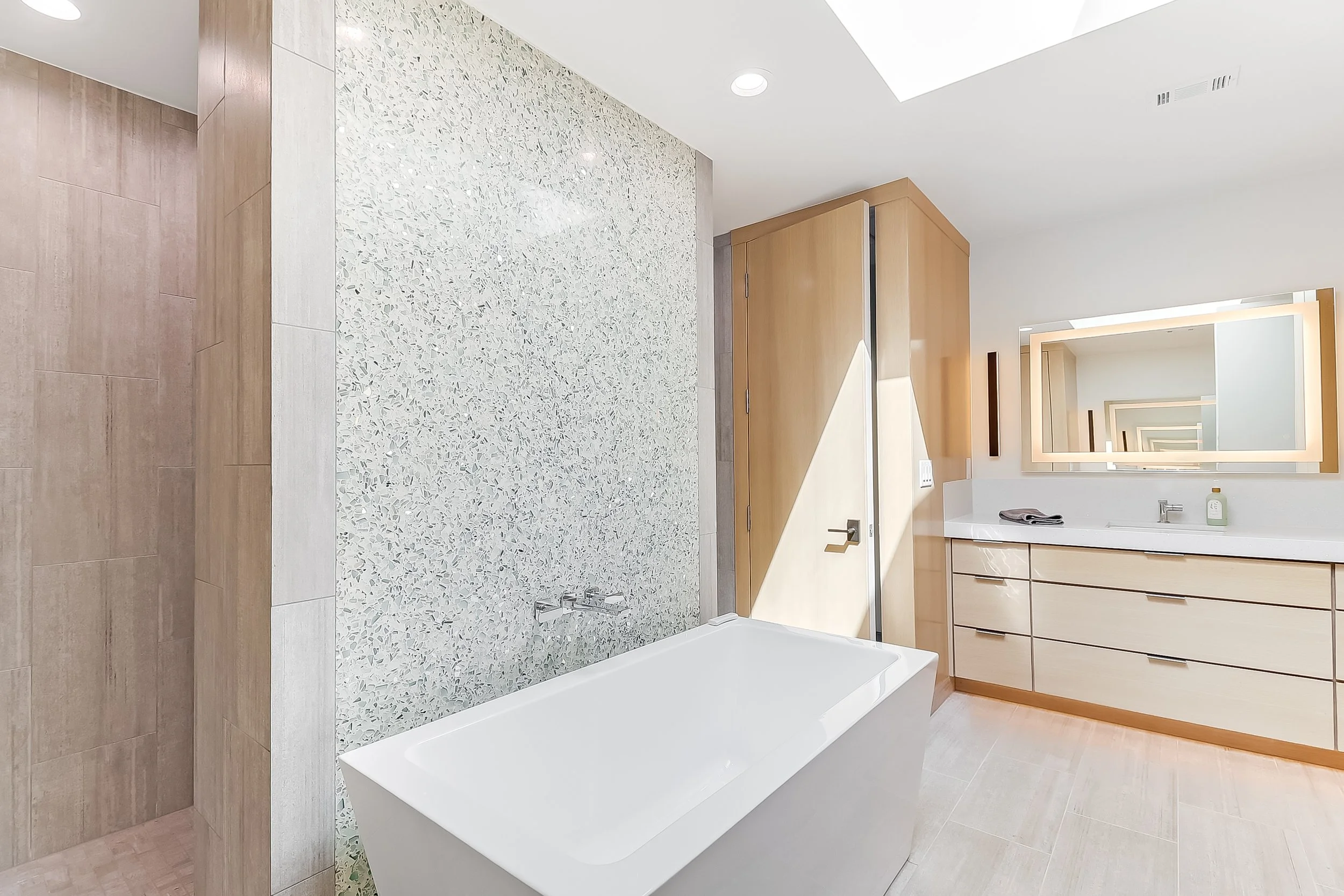 Primary bath w tub-wood cabinetry.jpg