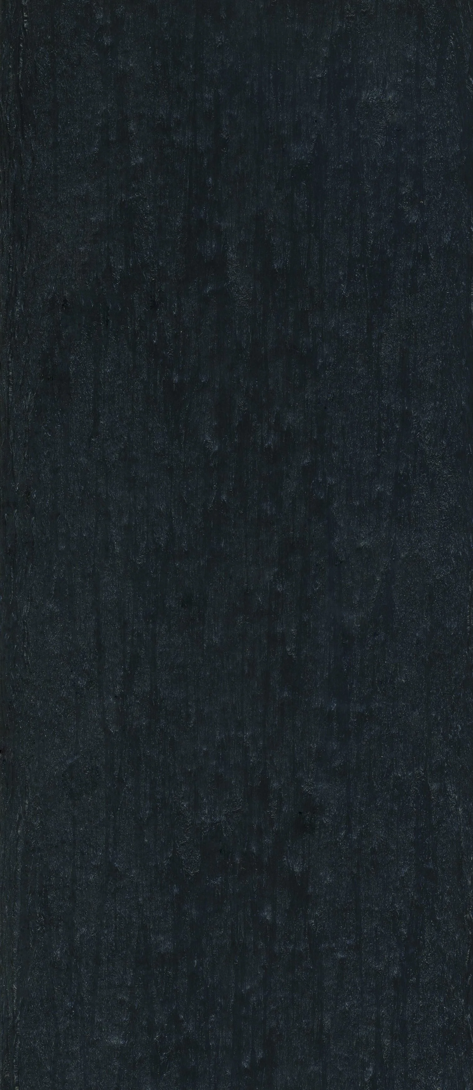 A close-up of a dark, textured chalkboard surface.